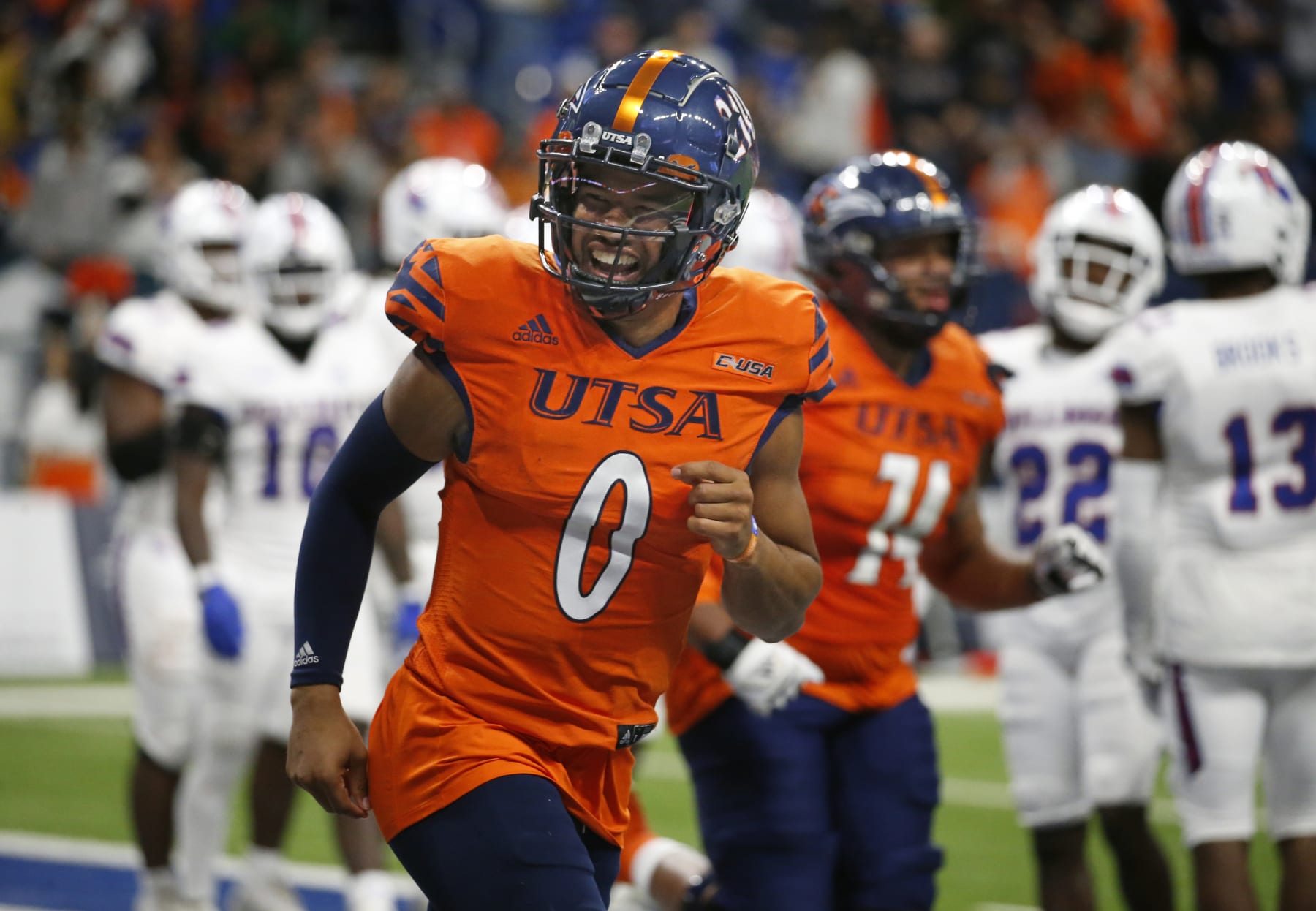 SAN ANTONIO, TX - NOVEMBER 12: Quarterback Frank Harris #0 of the UTSA Roadrunners celebrates with fans after a touchdown against Louisiana Tech Bulldogs in the second half at Alamodome on November 12, 2022 in San Antonio, Texas.  (Photo by Ronald Cortes/Getty Images)