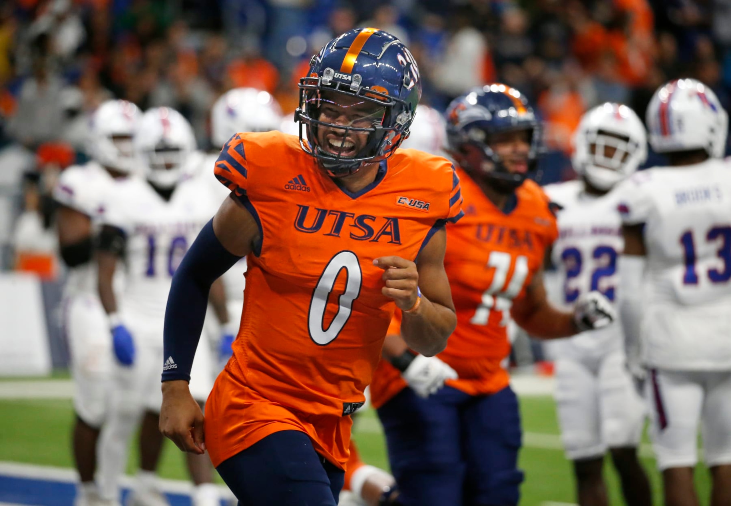 SAN ANTONIO, TX - NOVEMBER 12: Quarterback Frank Harris #0 of the UTSA Roadrunners celebrates with fans after a touchdown against Louisiana Tech Bulldogs in the second half at Alamodome on November 12, 2022 in San Antonio, Texas.  (Photo by Ronald Cortes/Getty Images)
