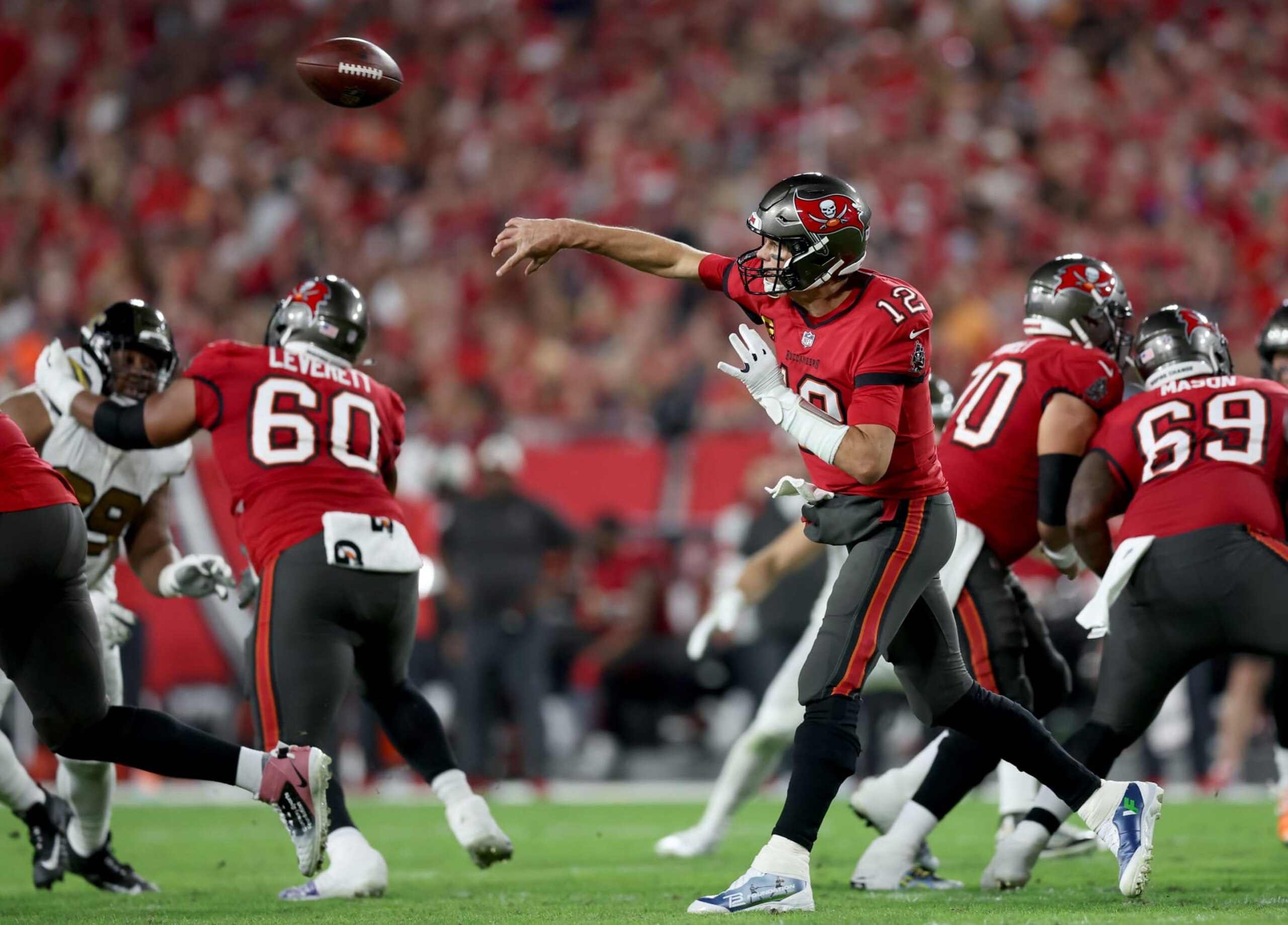 TAMPA, FLORIDA - DECEMBER 05: Tom Brady #12 of the Tampa Bay Buccaneers throws a pass against the New Orleans Saints during the second quarter in the game at Raymond James Stadium on December 05, 2022 in Tampa, Florida. (Photo by Mike Carlson/Getty Images) TAMPA, FLORIDA - DECEMBER 05: Tom Brady #12 of the Tampa Bay Buccaneers throws a pass against the New Orleans Saints during the second quarter in the game at Raymond James Stadium on December 05, 2022 in Tampa, Florida. (Photo by Mike Carlson/Getty Images)