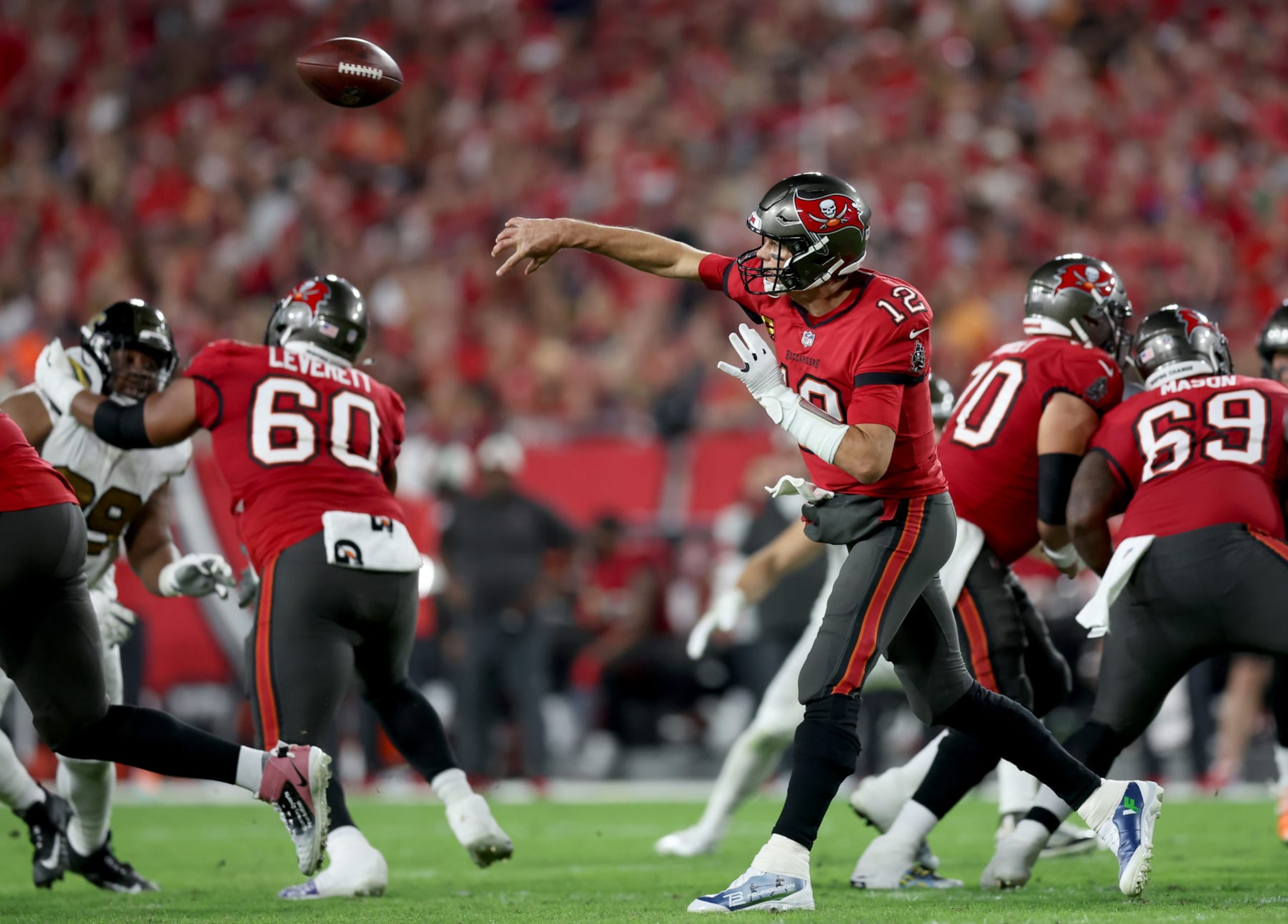 TAMPA, FLORIDA - DECEMBER 05: Tom Brady #12 of the Tampa Bay Buccaneers throws a pass against the New Orleans Saints during the second quarter in the game at Raymond James Stadium on December 05, 2022 in Tampa, Florida. (Photo by Mike Carlson/Getty Images)