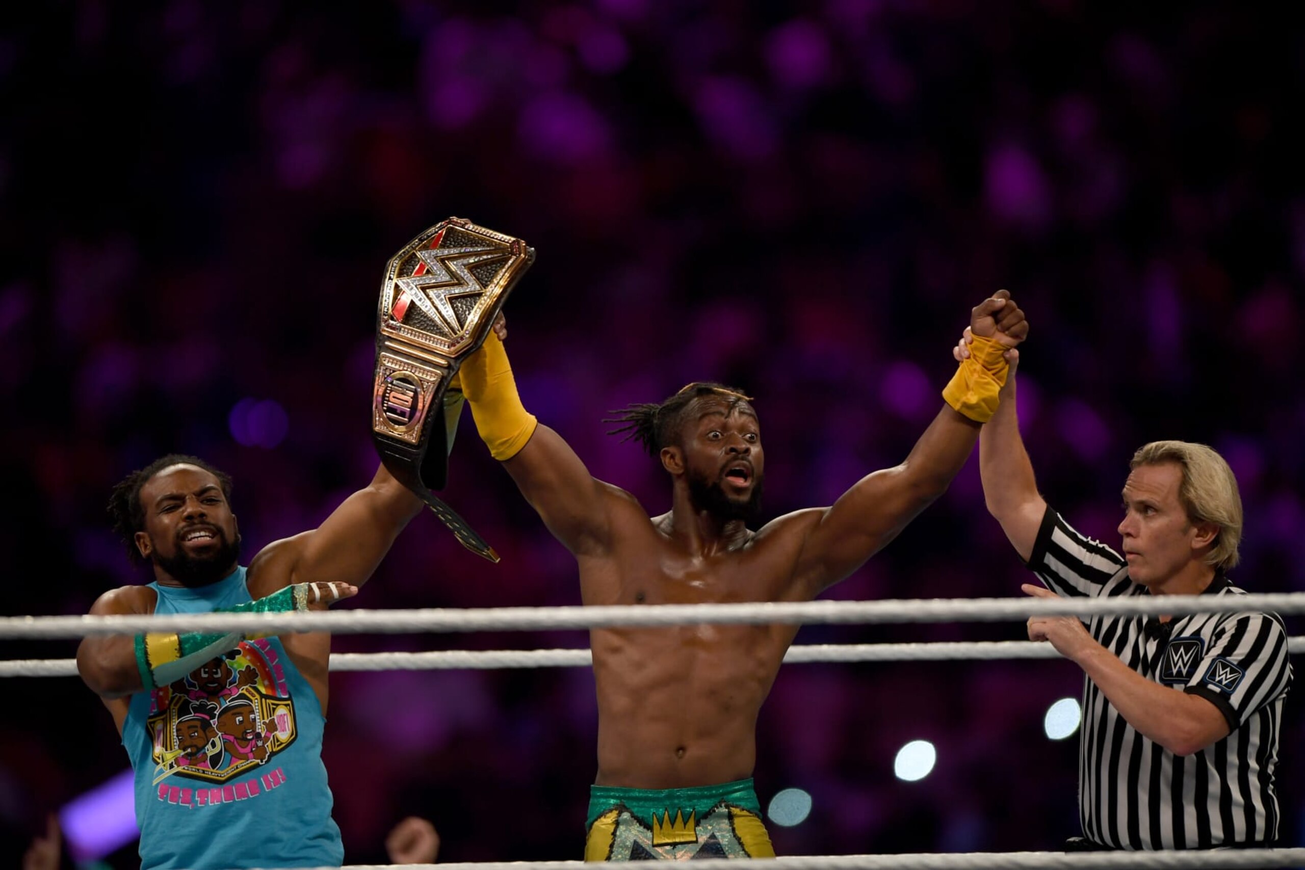 WWE Superstar Kofi Kingston (C) celebrates at the end of the World Wrestling Entertainment (WWE) Super Showdown event in Saudi Arabia's Red Sea port city of Jeddah late on January 7, 2019. (Photo by Amer HILABI / AFP)        (Photo credit should read AMER HILABI/AFP via Getty Images)