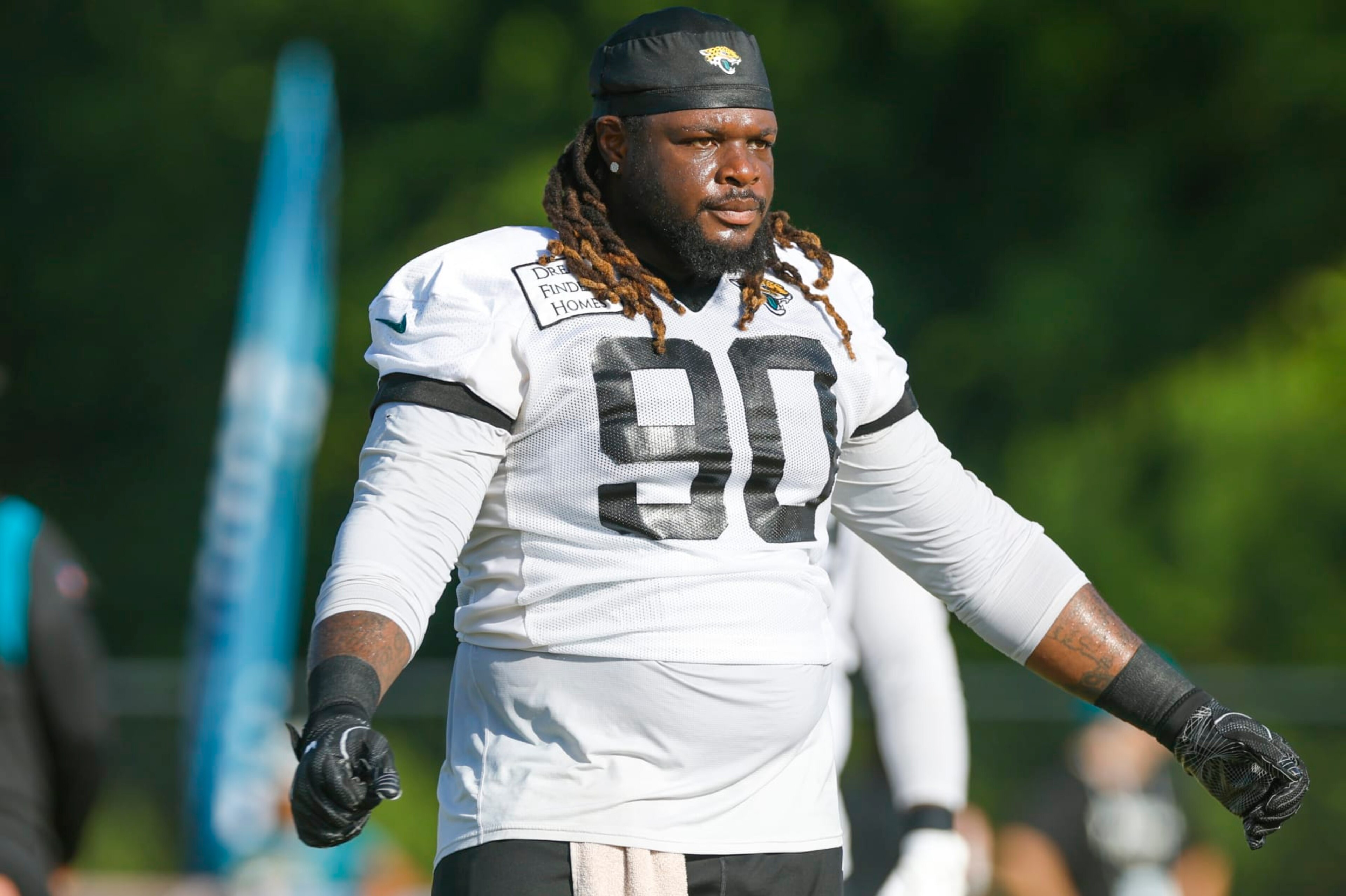 JACKSONVILLE, FL - JULY 28: Jacksonville Jaguars defensive tackle Malcom Brown (90) stretches during training camp on July 28, 2022 at Episcopal School of Jacksonville in Jacksonville, Fl. (Photo by David Rosenblum/Icon Sportswire via Getty Images)