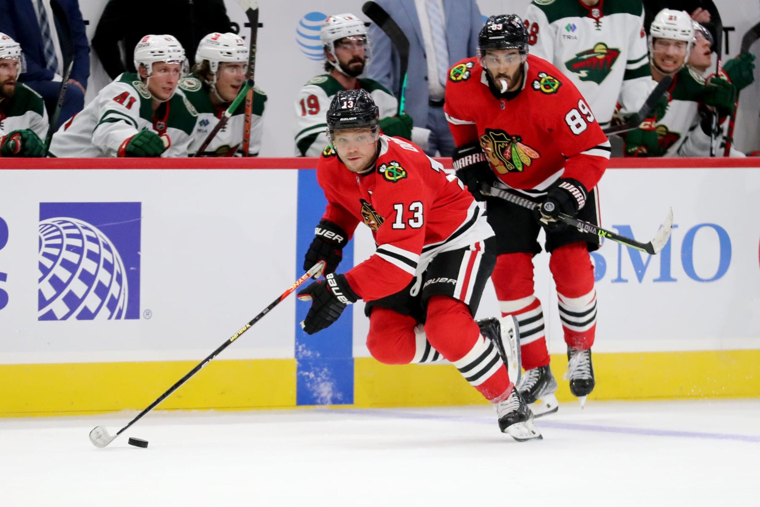 Chicago Blackhawks forwards Max Domi (left) and Andreas Athanasiou. 