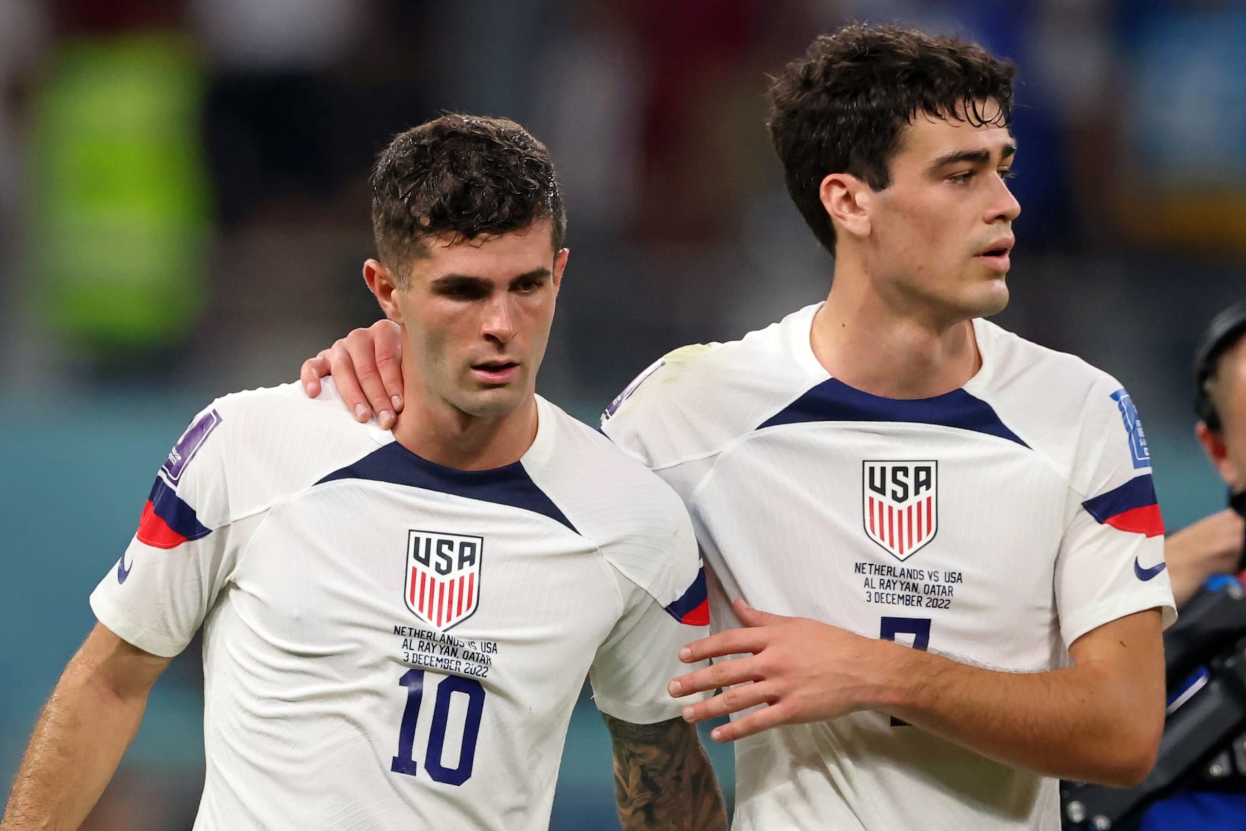 DOHA, QATAR - DECEMBER 03: Giovanni Reyna of USA  and Christian Pulisic of USA  look dejected after their sides' elimination from the tournament  the FIFA World Cup Qatar 2022 Round of 16 match between Netherlands and USA at Khalifa International Stadium on December 03, 2022 in Doha, Qatar. (Photo by Stefan Matzke - sampics/Corbis via Getty Images)