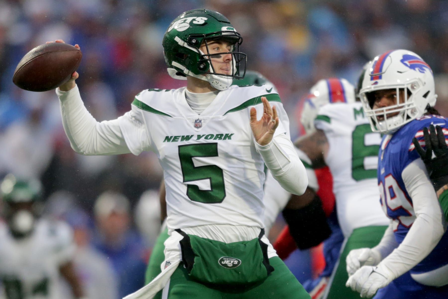 ORCHARD PARK, NEW YORK - DECEMBER 11: Mike White #5 of the New York Jets looks to pass in the first quarter of a game against the Buffalo Bills at Highmark Stadium on December 11, 2022 in Orchard Park, New York. (Photo by Joshua Bessex/Getty Images)