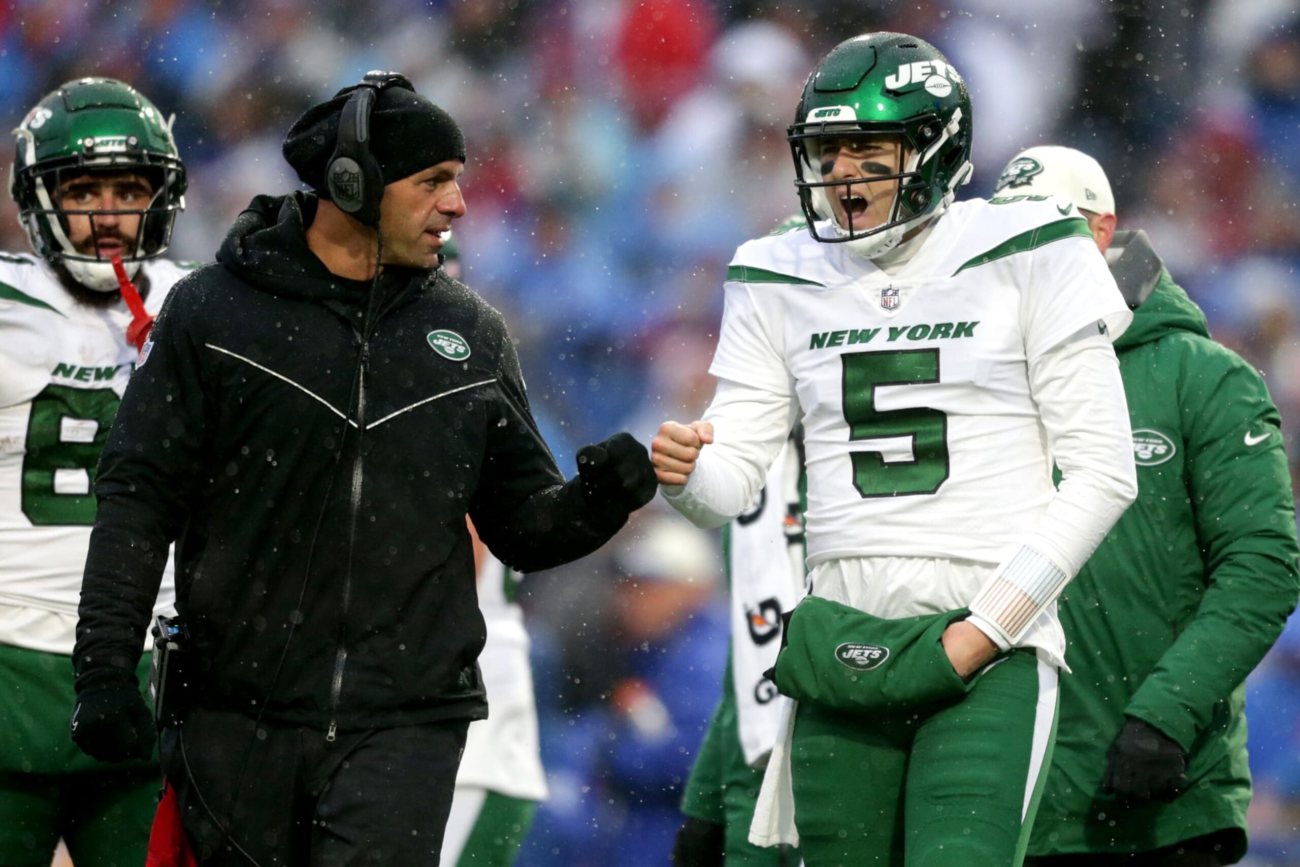 ORCHARD PARK, NEW YORK - DECEMBER 11: Mike White #5 of the New York Jets fist bumps head coach Robert Saleh of the New York Jets in the second quarter of a game against the Buffalo Bills at Highmark Stadium on December 11, 2022 in Orchard Park, New York. (Photo by Joshua Bessex/Getty Images)