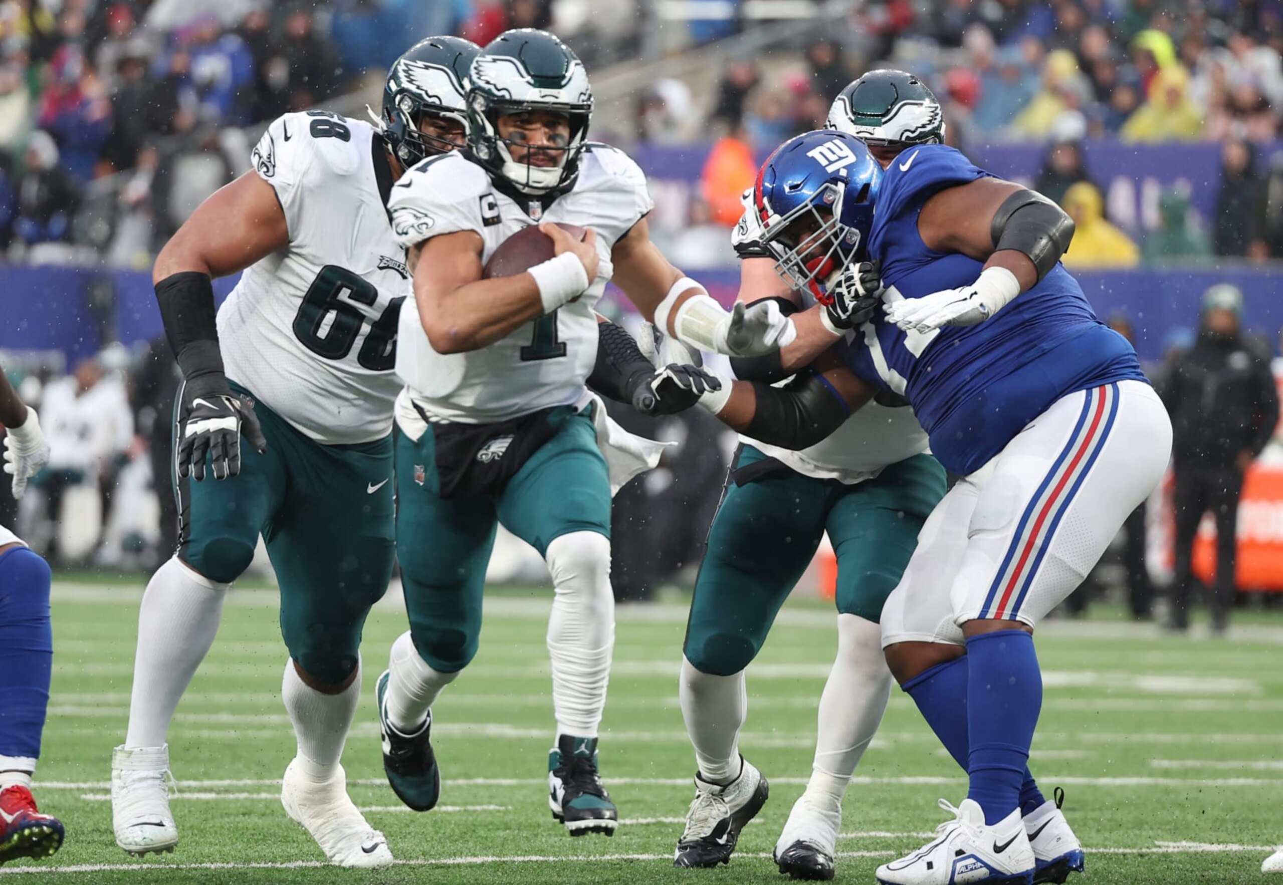 EAST RUTHERFORD, NEW JERSEY - DECEMBER 11: Jalen Hurts #1 of the Philadelphia Eagles runs the ball for a touchdown during the third quarter against the New York Giants at MetLife Stadium on December 11, 2022 in East Rutherford, New Jersey. (Photo by Al Bello/Getty Images) EAST RUTHERFORD, NEW JERSEY - DECEMBER 11: Jalen Hurts #1 of the Philadelphia Eagles runs the ball for a touchdown during the third quarter against the New York Giants at MetLife Stadium on December 11, 2022 in East Rutherford, New Jersey. (Photo by Al Bello/Getty Images)