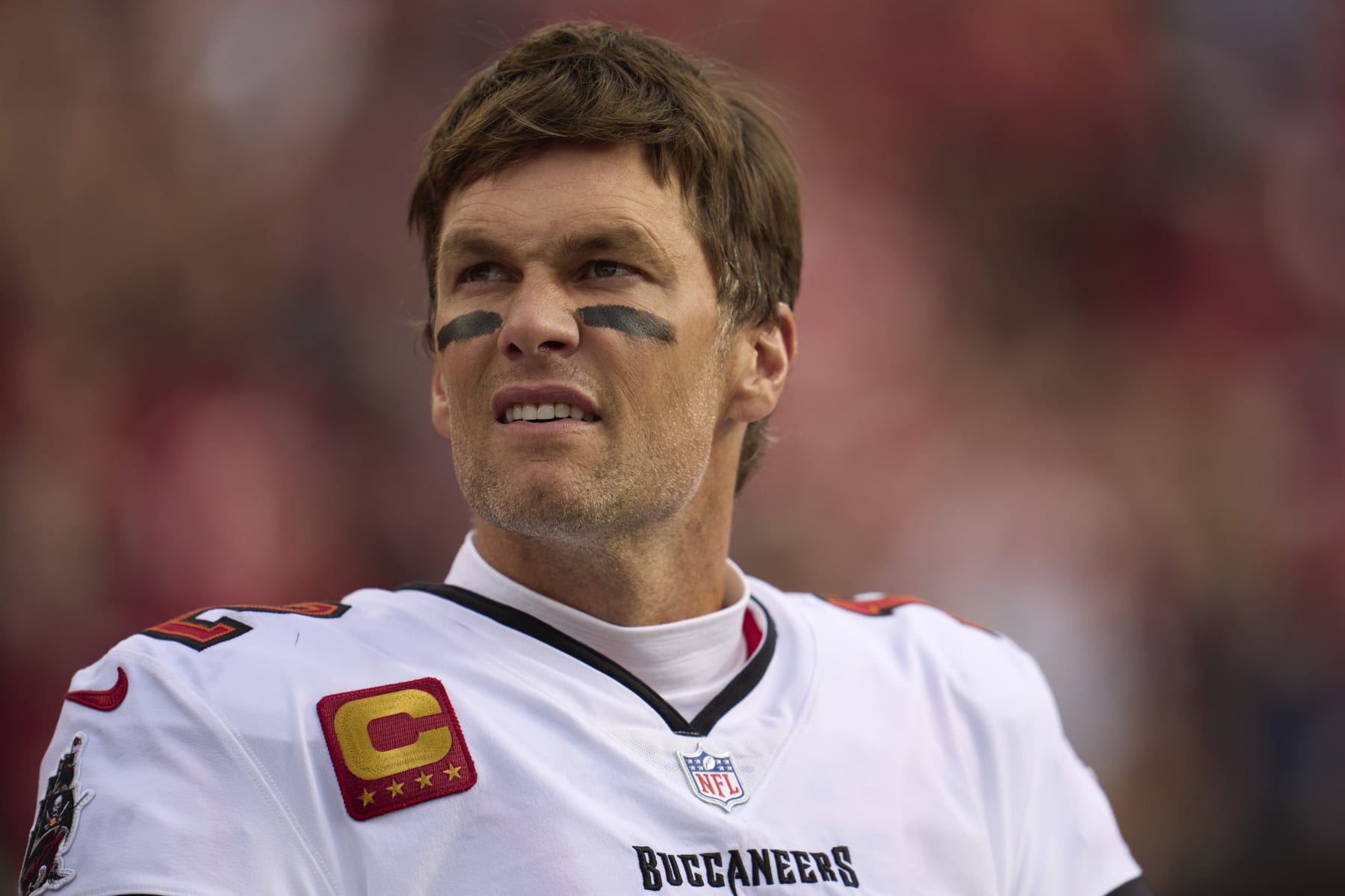 SANTA CLARA, CA - DECEMBER 11: Tom Brady #12 of the Tampa Bay Buccaneers looks on from the sideline before kickoff against the San Francisco 49ers at Levi's Stadium on December 11, 2022 in Santa Clara, California. (Photo by Cooper Neill/Getty Images)