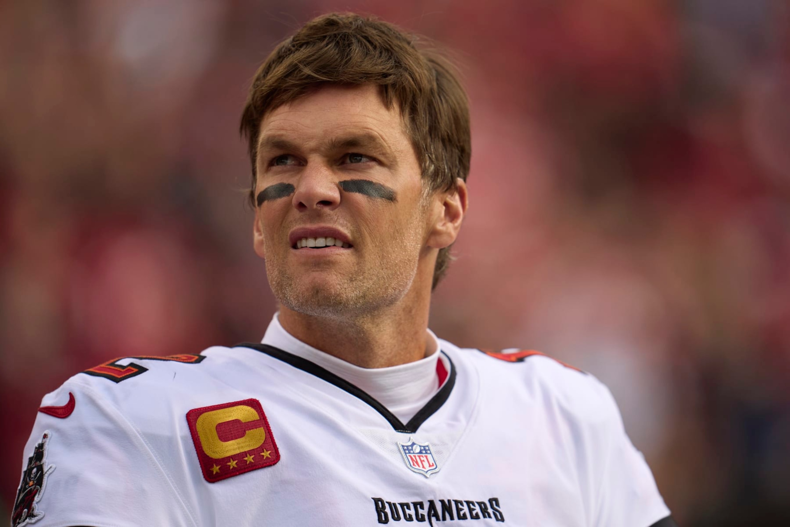 SANTA CLARA, CA - DECEMBER 11: Tom Brady #12 of the Tampa Bay Buccaneers looks on from the sideline before kickoff against the San Francisco 49ers at Levi's Stadium on December 11, 2022 in Santa Clara, California. (Photo by Cooper Neill/Getty Images)