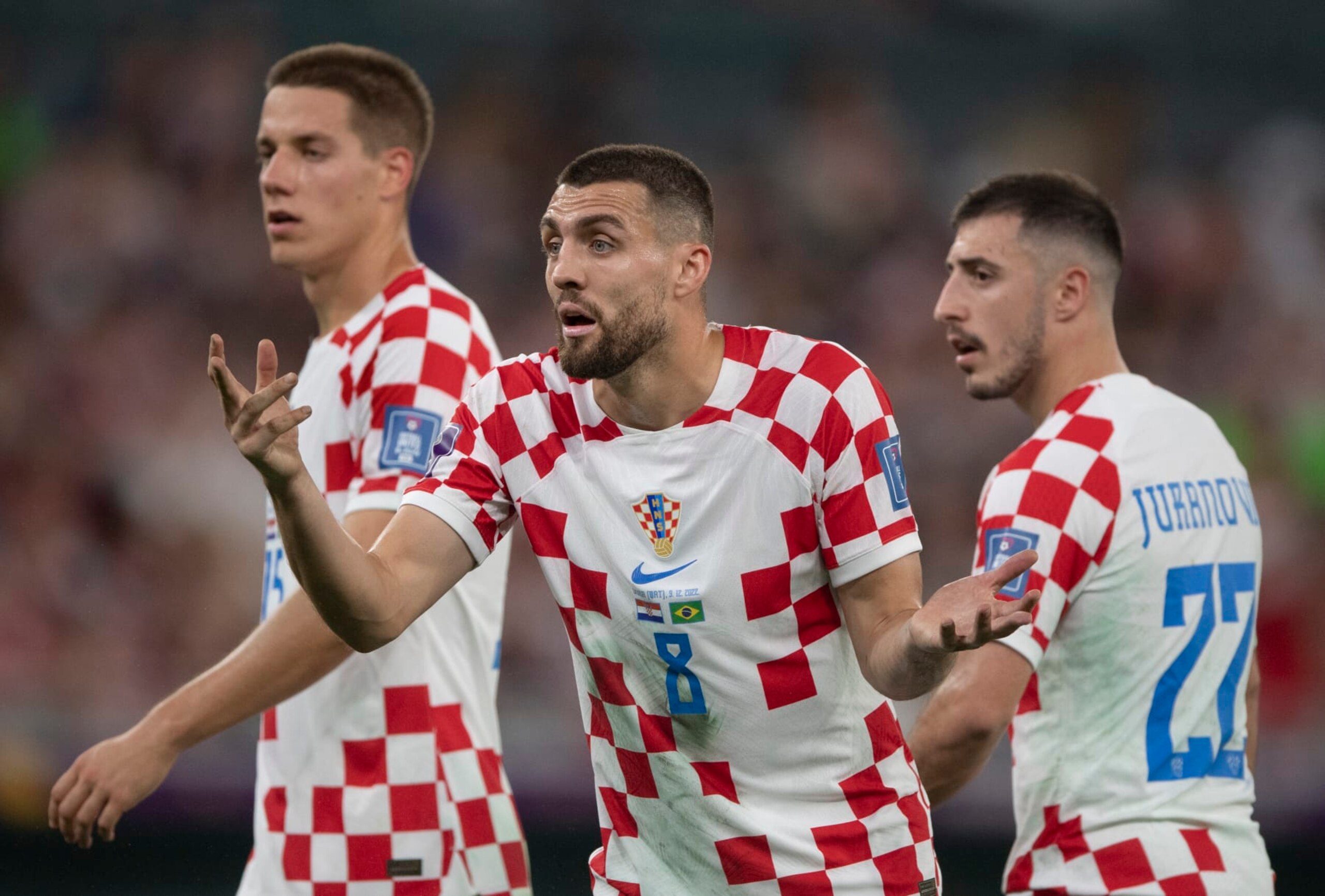 AL RAYYAN, QATAR - DECEMBER 09: Mateo Kovacic, Mario Pasalic and Josip Juranovic of Croatia during the FIFA World Cup Qatar 2022 quarter final match between Croatia and Brazil at Education City Stadium on December 9, 2022 in Al Rayyan, Qatar. (Photo by Visionhaus/Getty Images)