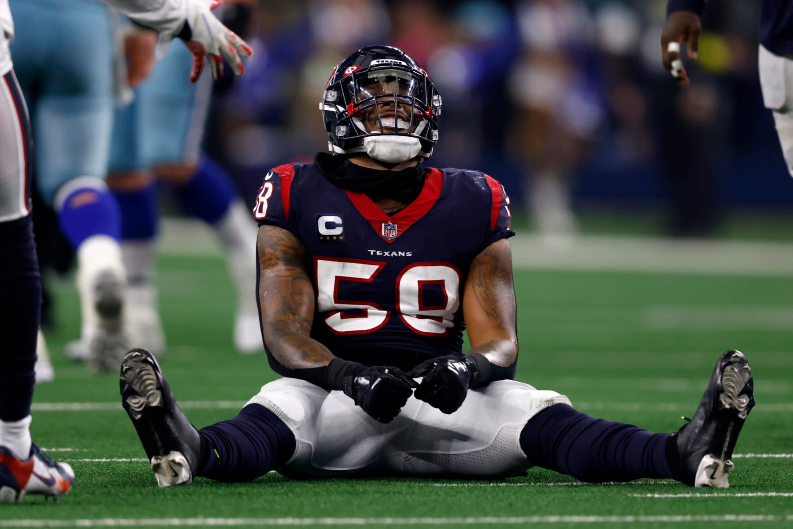 Houston Texans linebacker Christian Kirksey (58) sits on the field between plays against the Dallas Cowboys during an NFL football game in Arlington, Texas, Sunday, Dec. 11, 2022. (AP Photo/Ron Jenkins)