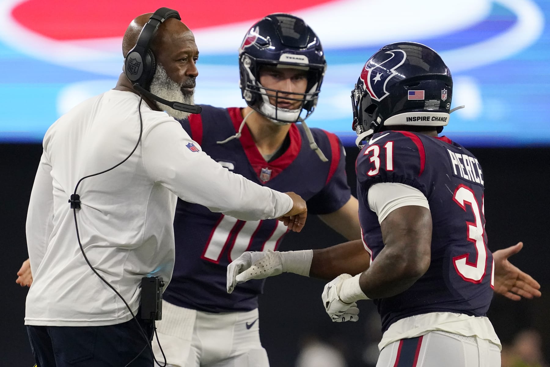 ARLINGTON, TEXAS - DECEMBER 11: Dameon Pierce #31 of the Houston Texans celebrates with head coach Lovie Smith of the Houston Texans after scoring a touchdown in the first half at AT&T Stadium on December 11, 2022 in Arlington, Texas. (Photo by Sam Hodde/Getty Images)