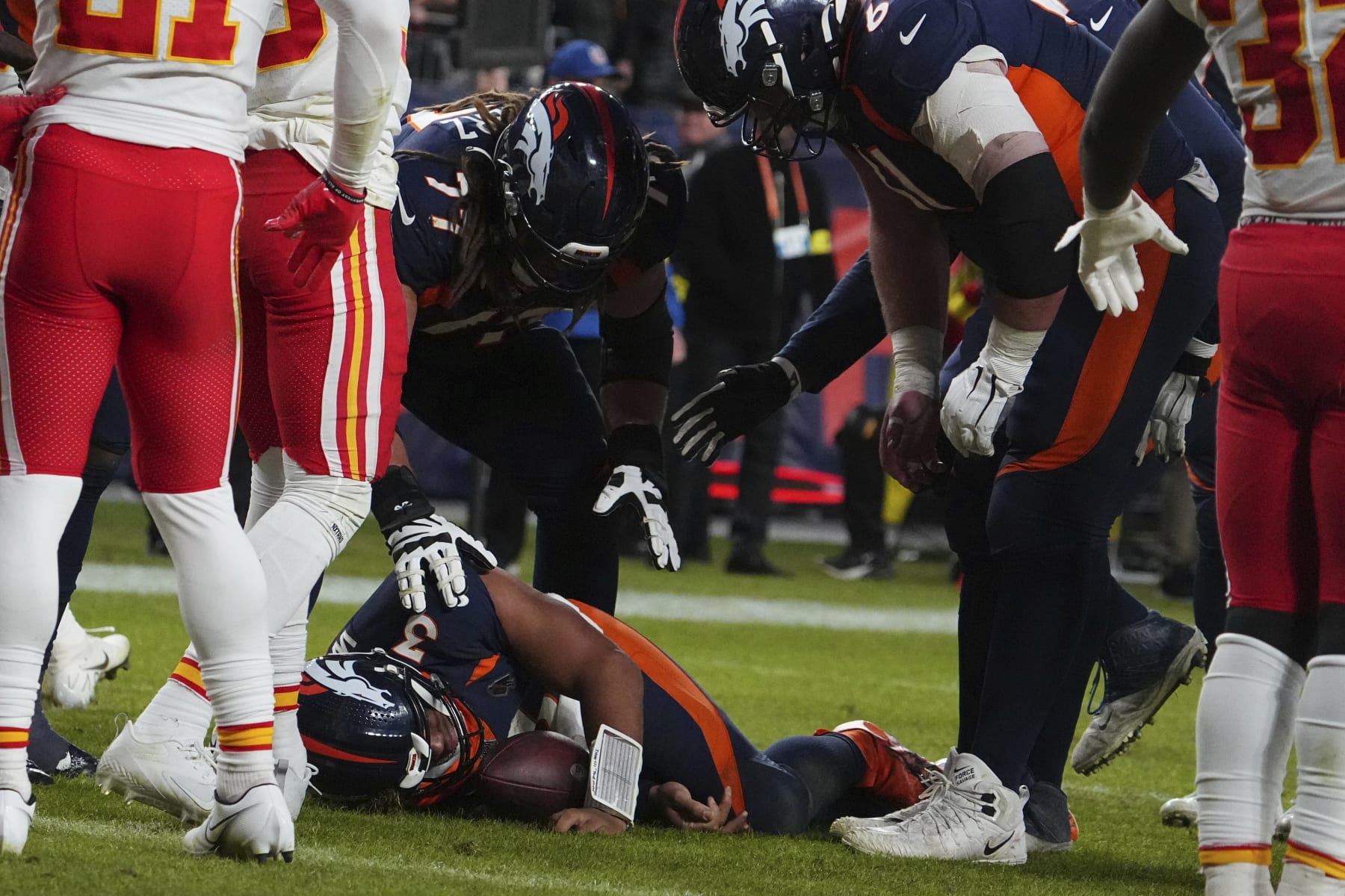 Denver Broncos quarterback Russell Wilson (3) is injured against the Kansas City Chiefs of an NFL football game Sunday, December 11, 2022, in Denver. (AP Photo/Bart Young)