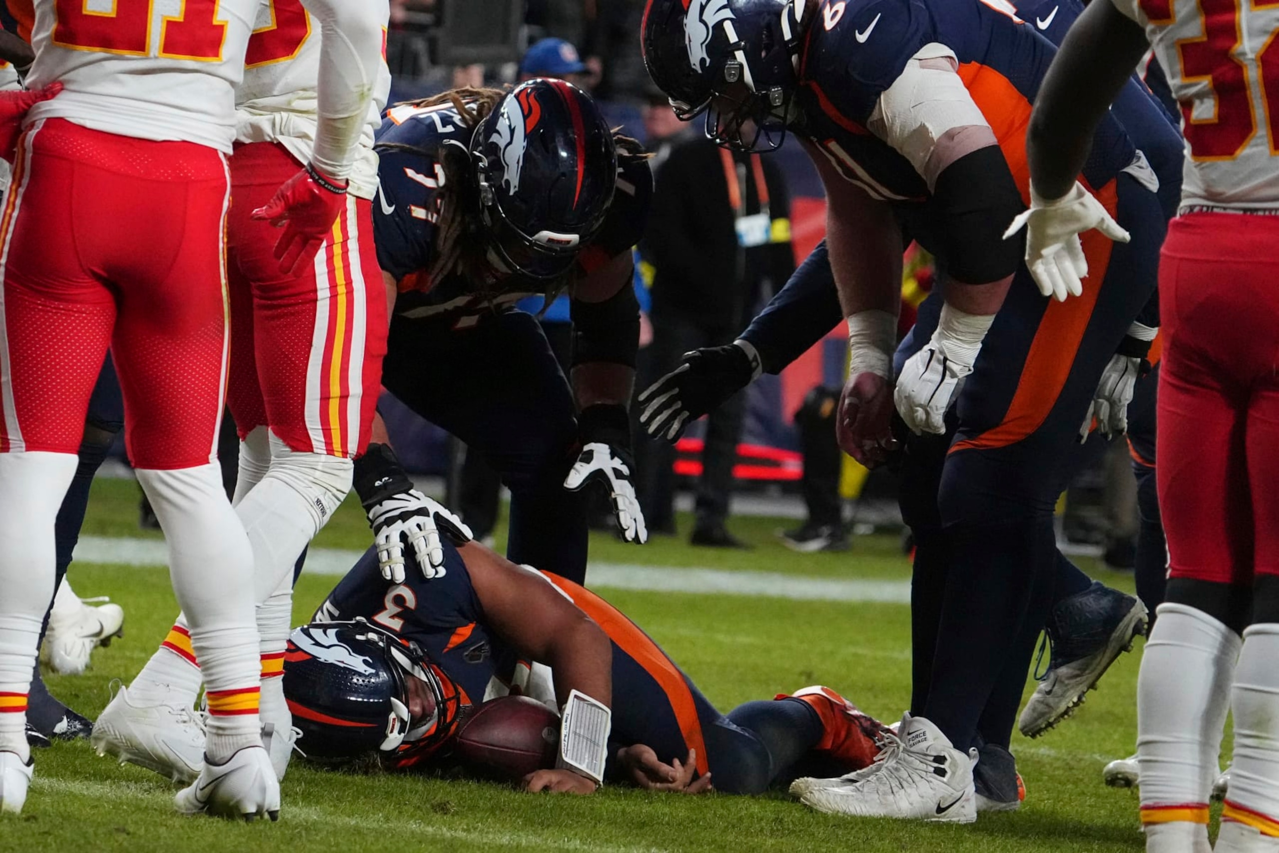 Denver Broncos quarterback Russell Wilson (3) is injured against the Kansas City Chiefs of an NFL football game Sunday, December 11, 2022, in Denver. (AP Photo/Bart Young)