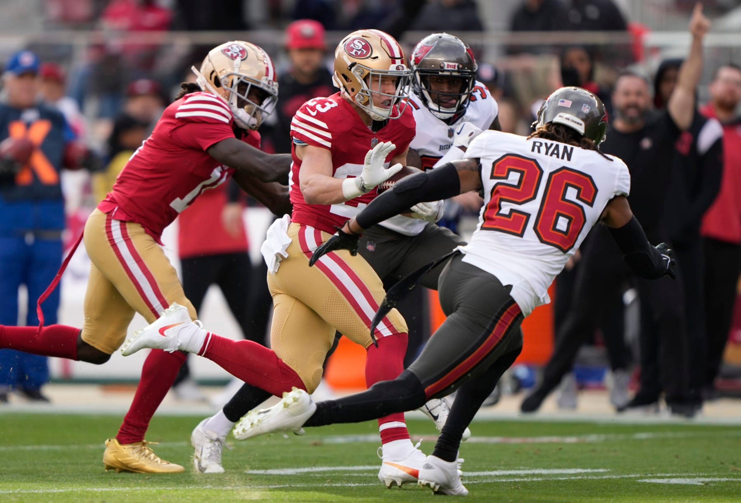 SANTA CLARA, CALIFORNIA - DECEMBER 11: Christian McCaffrey #23 of the San Francisco 49ers runs with the ball during the first quarter of the game against the Tampa Bay Buccaneers at Levi's Stadium on December 11, 2022 in Santa Clara, California. (Photo by Thearon W. Henderson/Getty Images)