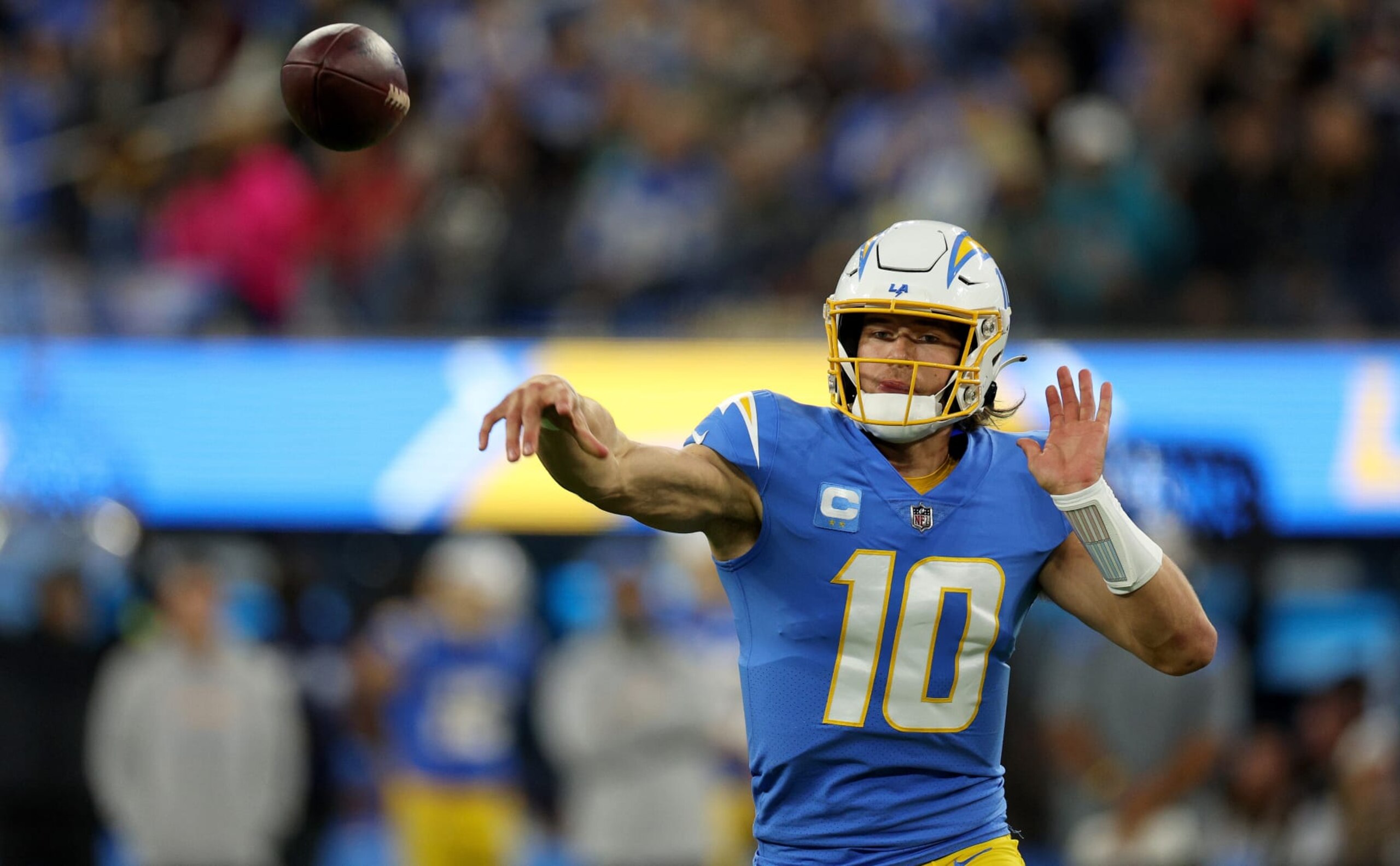 INGLEWOOD, CALIFORNIA - DECEMBER 11: Justin Herbert #10 of the Los Angeles Chargers passes during a game against the Miami Dolphins at SoFi Stadium on December 11, 2022 in Inglewood, California. (Photo by Harry How/Getty Images)