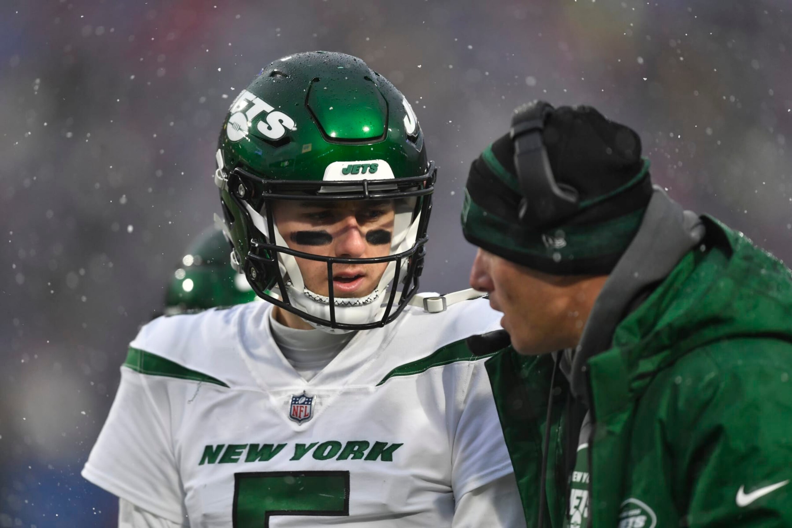 New York Jets quarterback Mike White, left, during the second half of an NFL football game against the Buffalo Bills, Sunday, Dec. 11, 2022, in Orchard Park, N.Y. (AP Photo/Adrian Kraus)