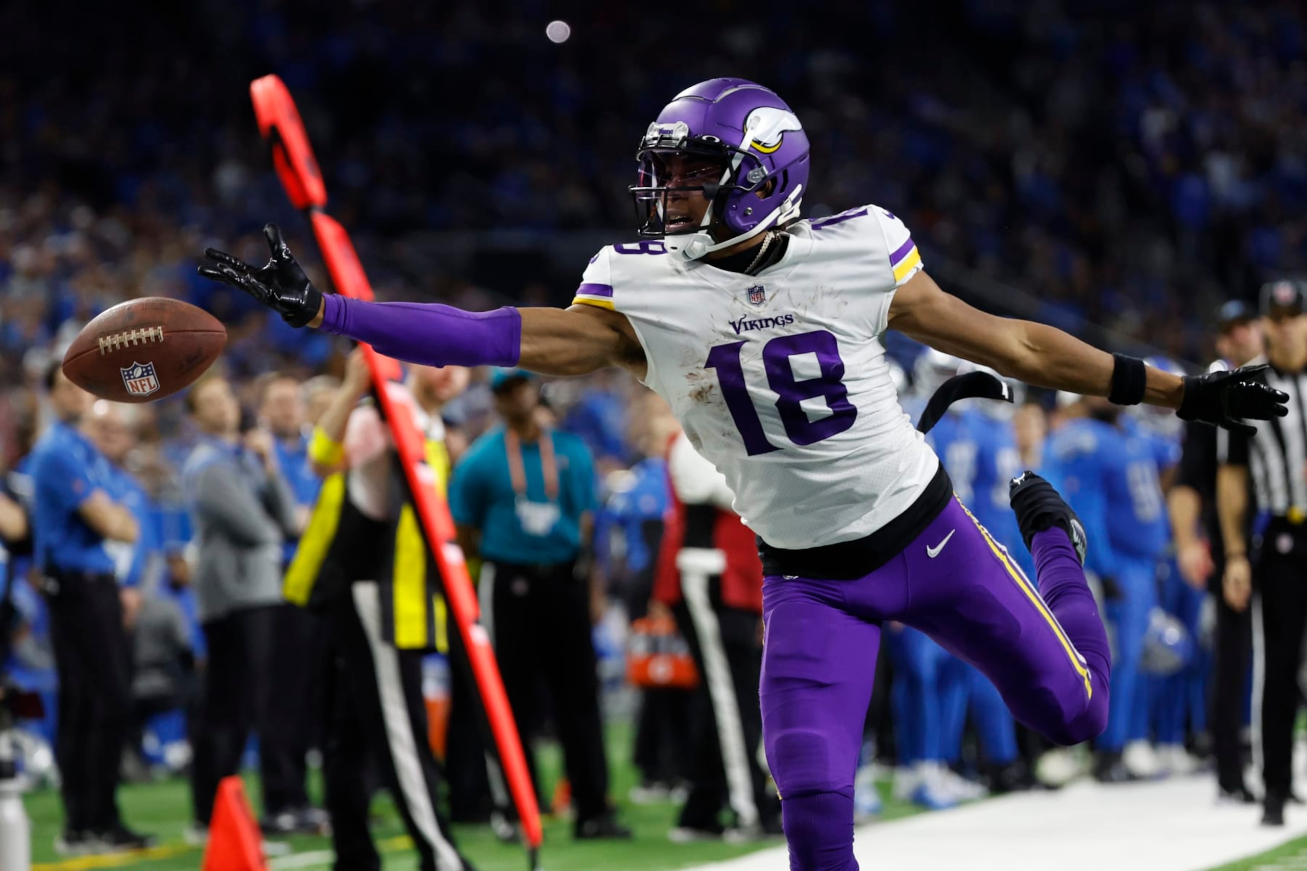 Minnesota Vikings wide receiver Justin Jefferson (18) tries to make a reception in the second half against the Detroit Lions during an NFL football game, Sunday, Dec. 11, 2022, in Detroit. (AP Photo/Rick Osentoski)