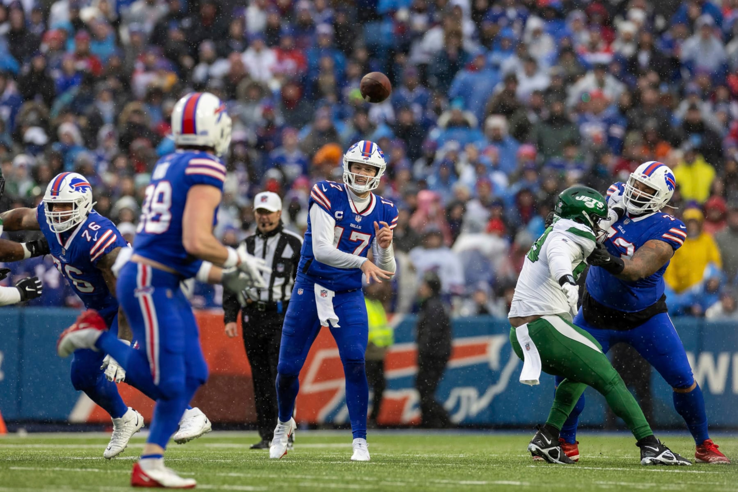 Buffalo Bills quarterback Josh Allen (17) passes the ball against the New York Jets in an NFL football game, Sunday, Dec. 11, 2022, in Orchard Park, NY. (AP Photo/Jeff Lewis)