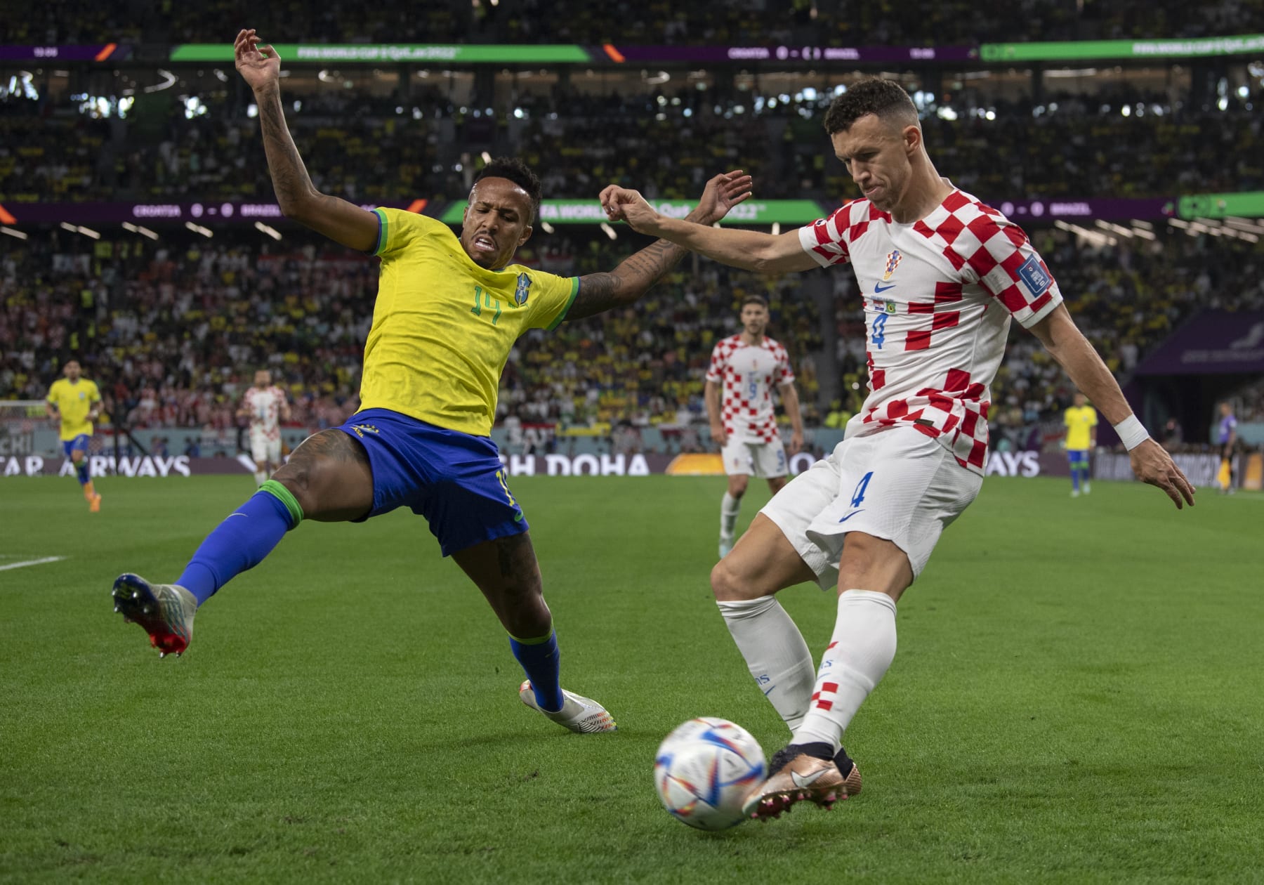 AL RAYYAN, QATAR - DECEMBER 09: Eder Militao of Brazil and Ivan Perisic of Croatia in action during the FIFA World Cup Qatar 2022 quarter final match between Croatia and Brazil at Education City Stadium on December 9, 2022 in Al Rayyan, Qatar. (Photo by Visionhaus/Getty Images)