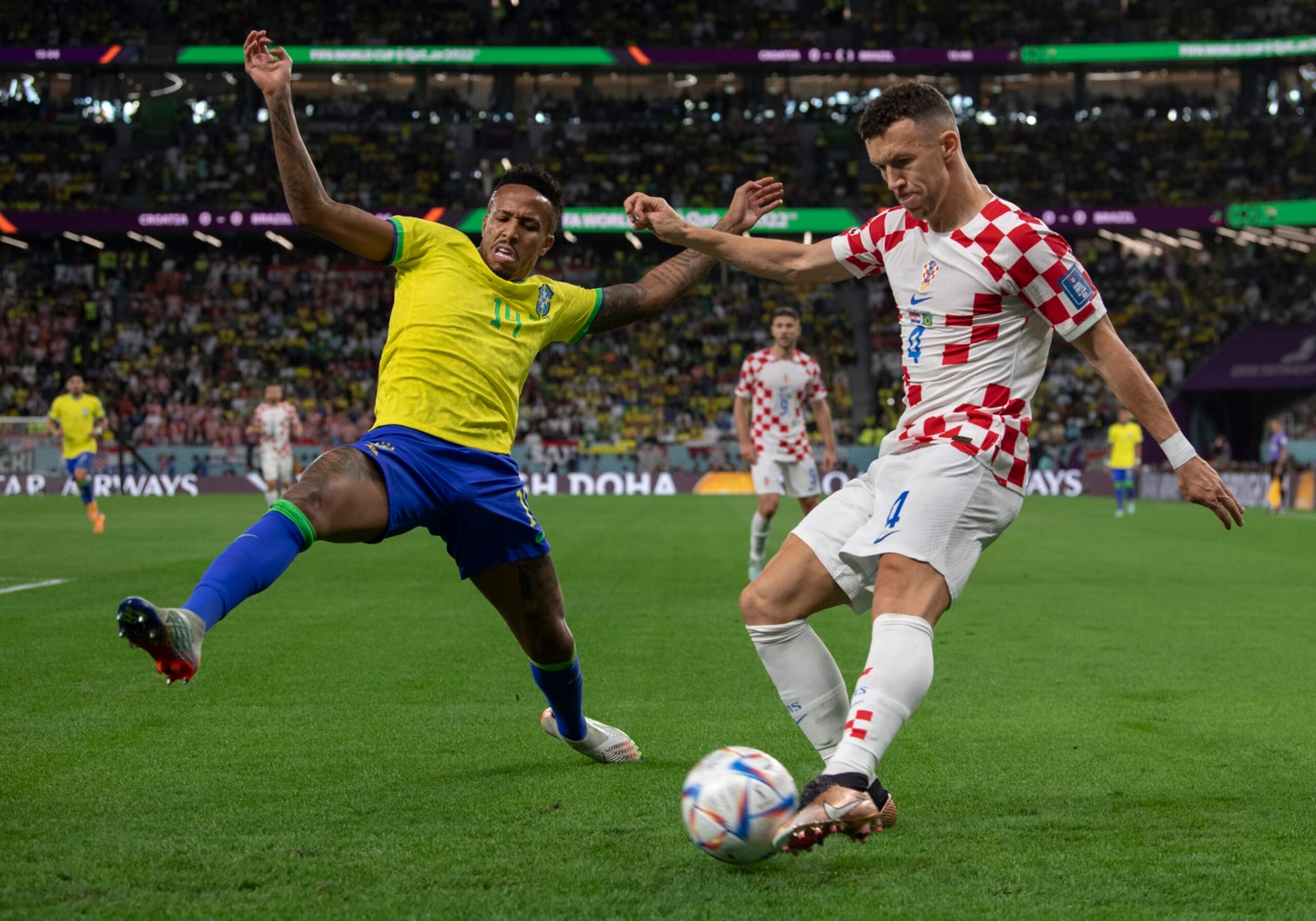 AL RAYYAN, QATAR - DECEMBER 09: Eder Militao of Brazil and Ivan Perisic of Croatia in action during the FIFA World Cup Qatar 2022 quarter final match between Croatia and Brazil at Education City Stadium on December 9, 2022 in Al Rayyan, Qatar. (Photo by Visionhaus/Getty Images)