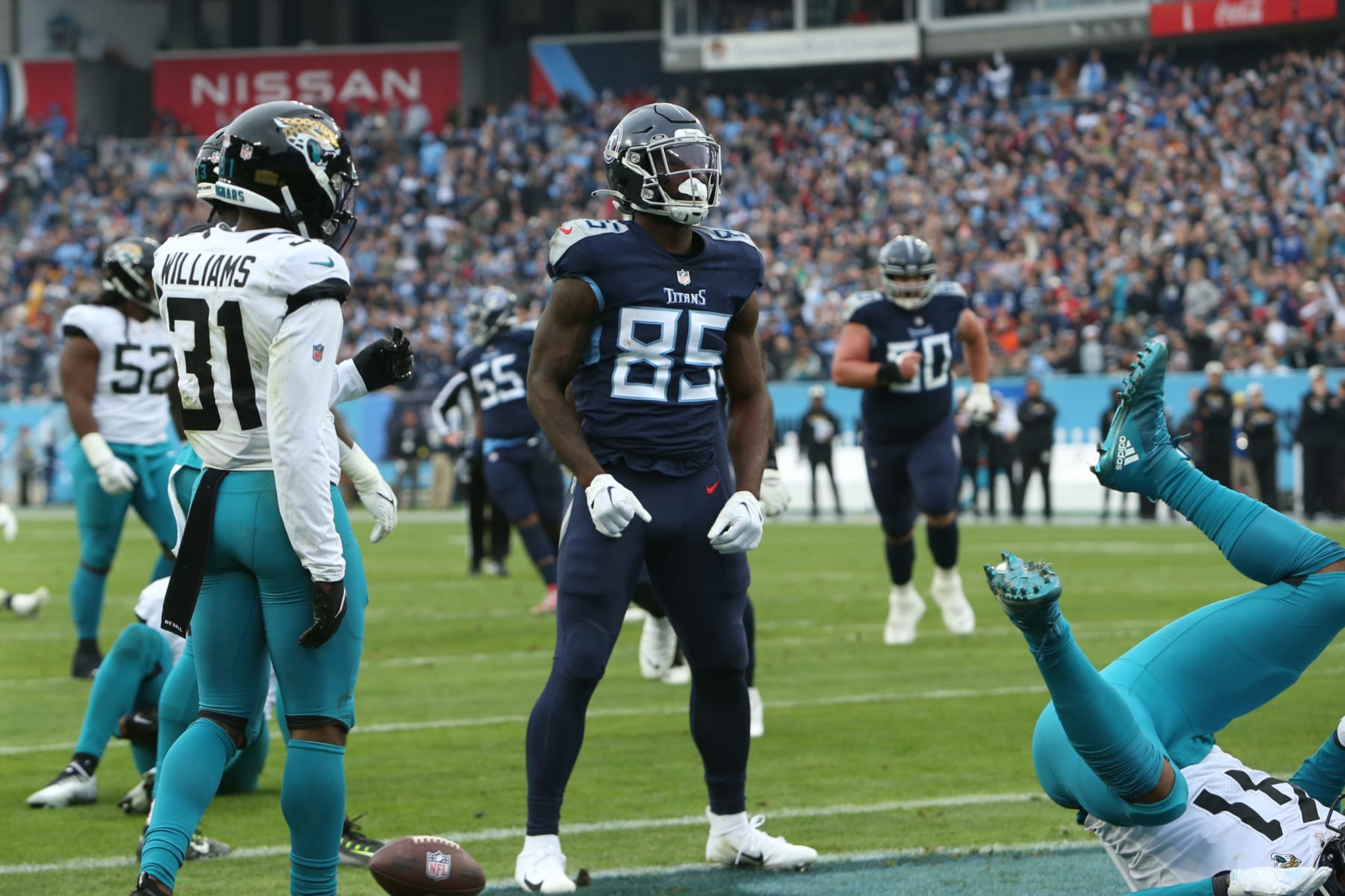 NASHVILLE, TN - DECEMBER 11: Tennessee Titans tight end Chigoziem Okonkwo (85) celebrates after scoring a touchdown during a game between the Tennessee Titans and Jacksonville Jaguars, December 11, 2022, at Nissan Stadium in Nashville, Tennessee. (Photo by Matthew Maxey/Icon Sportswire via Getty Images)