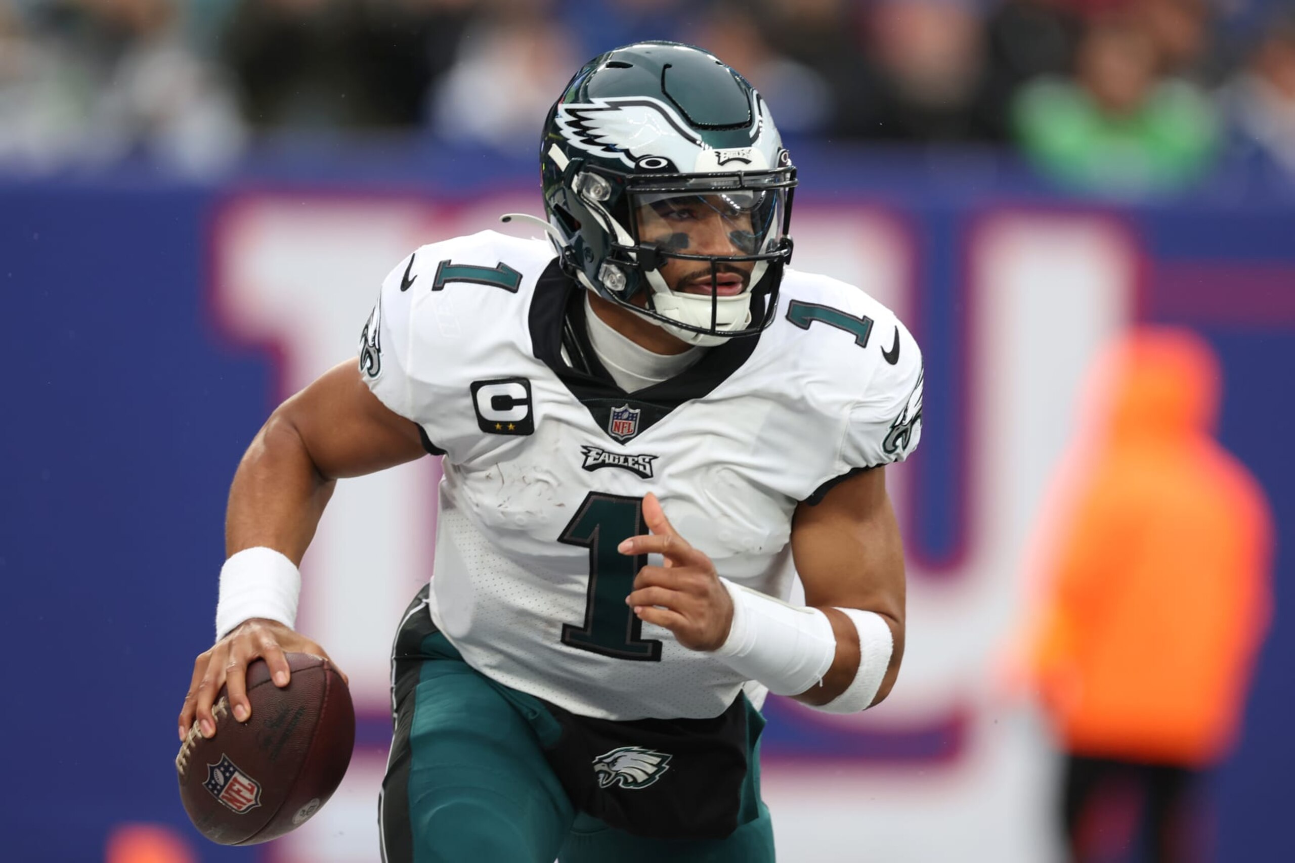 EAST RUTHERFORD, NEW JERSEY - DECEMBER 11: Jalen Hurts #1 of the Philadelphia Eagles carries the ball during the first half of the game against the New York Giants at MetLife Stadium on December 11, 2022 in East Rutherford, New Jersey. (Photo by Al Bello/Getty Images)