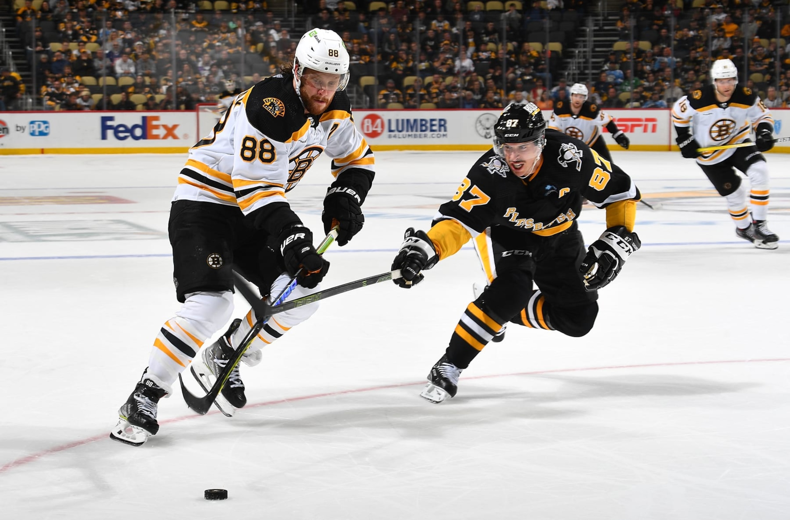 Boston Bruins winger David Pastrnak (left) and Pittsburgh Penguins captain Sidney Crosby. 
