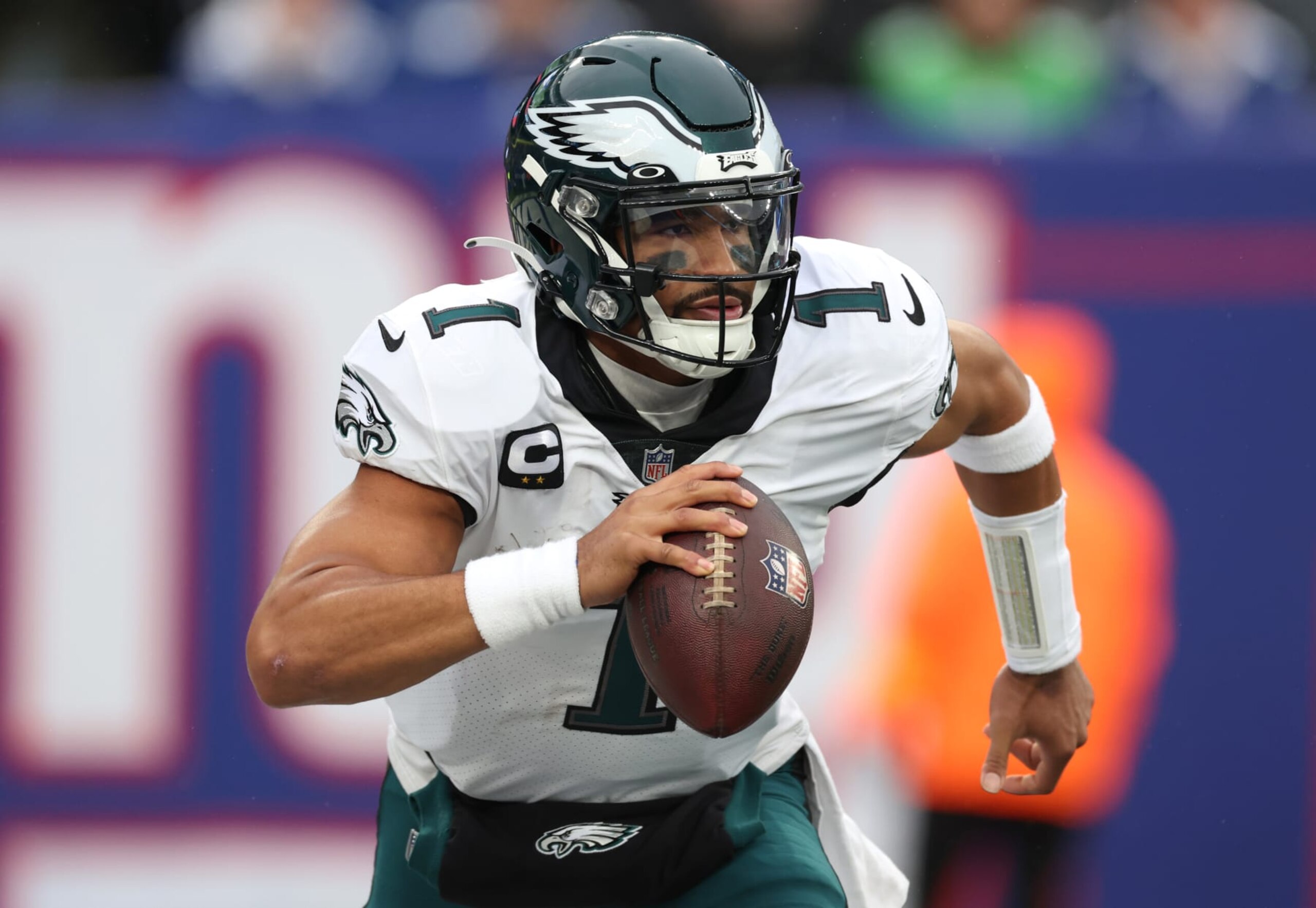 EAST RUTHERFORD, NEW JERSEY - DECEMBER 11: Jalen Hurts #1 of the Philadelphia Eagles carries the ball during the first half of the game against the New York Giants at MetLife Stadium on December 11, 2022 in East Rutherford, New Jersey. (Photo by Al Bello/Getty Images)
