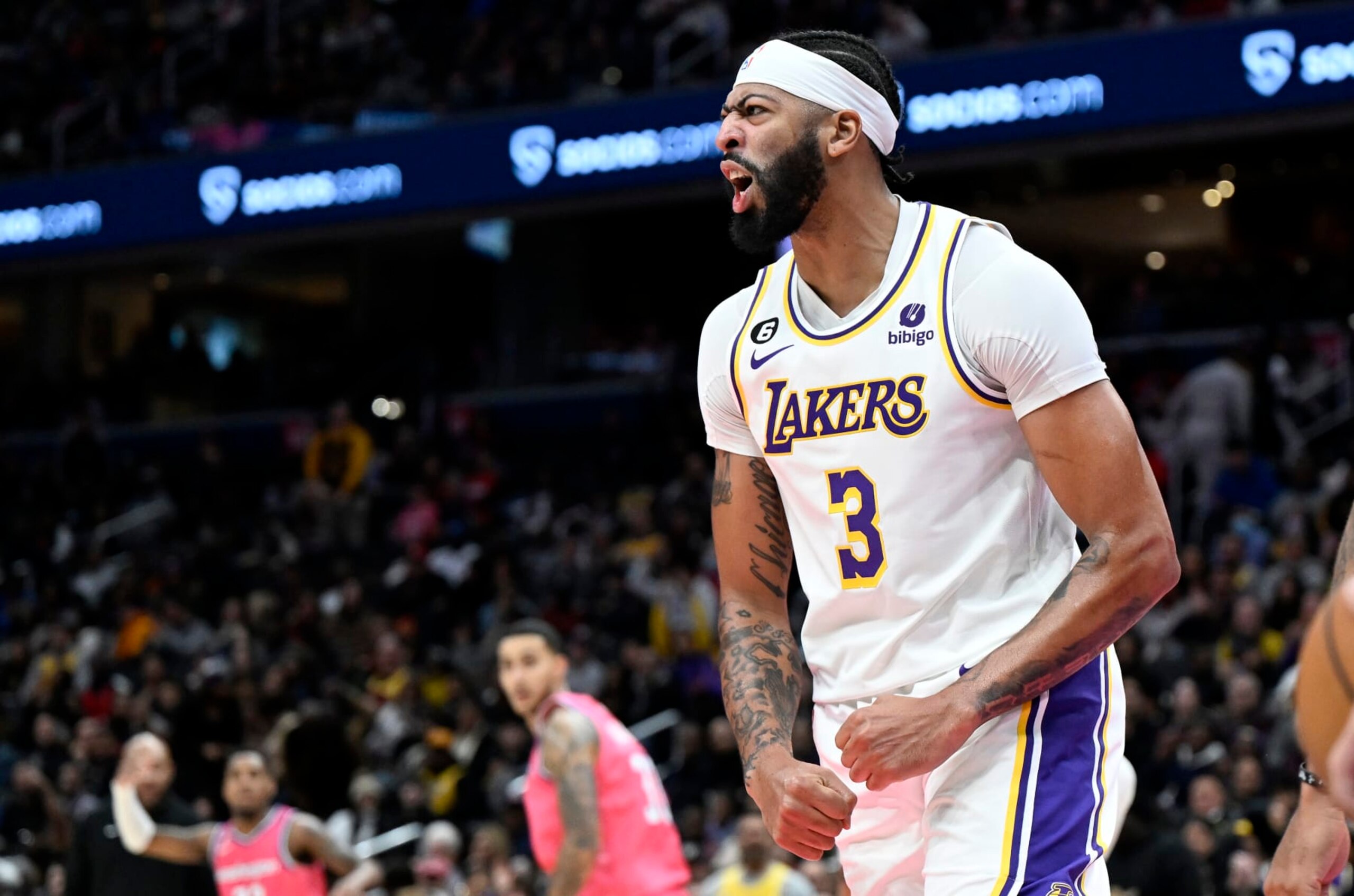 WASHINGTON, DC - DECEMBER 04: Anthony Davis #3 of the Los Angeles Lakers celebrates after dunking the ball against the Washington Wizards at Capital One Arena on December 04, 2022 in Washington, DC. NOTE TO USER: User expressly acknowledges and agrees that, by downloading and or using this photograph, User is consenting to the terms and conditions of the Getty Images License Agreement.  (Photo by G Fiume/Getty Images)