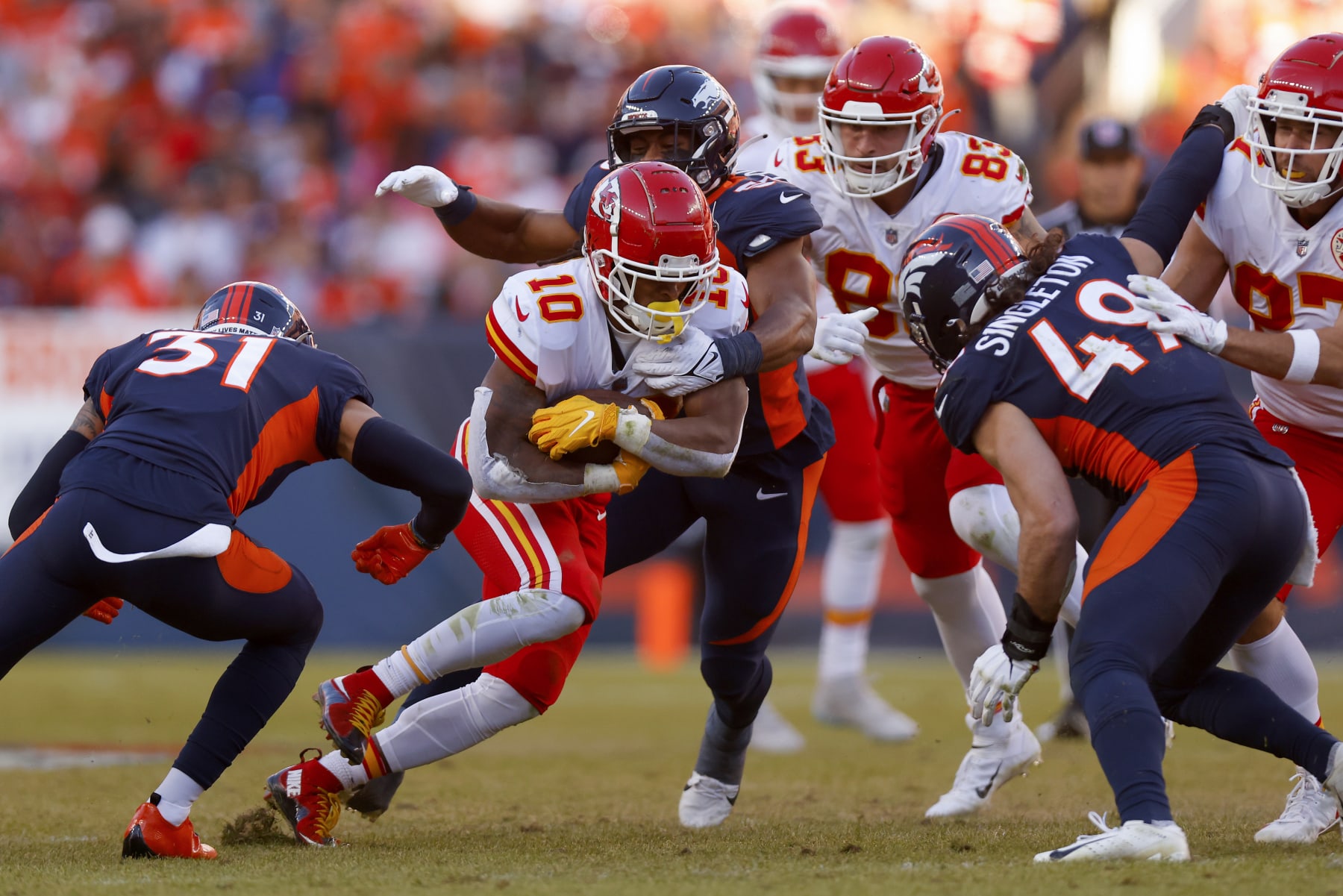 DENVER, COLORADO - DECEMBER 11: Isiah Pacheco #10 of the Kansas City Chiefs runs with the ball in the second quarter of a game against the Denver Broncos at Empower Field At Mile High on December 11, 2022 in Denver, Colorado. (Photo by Justin Edmonds/Getty Images)