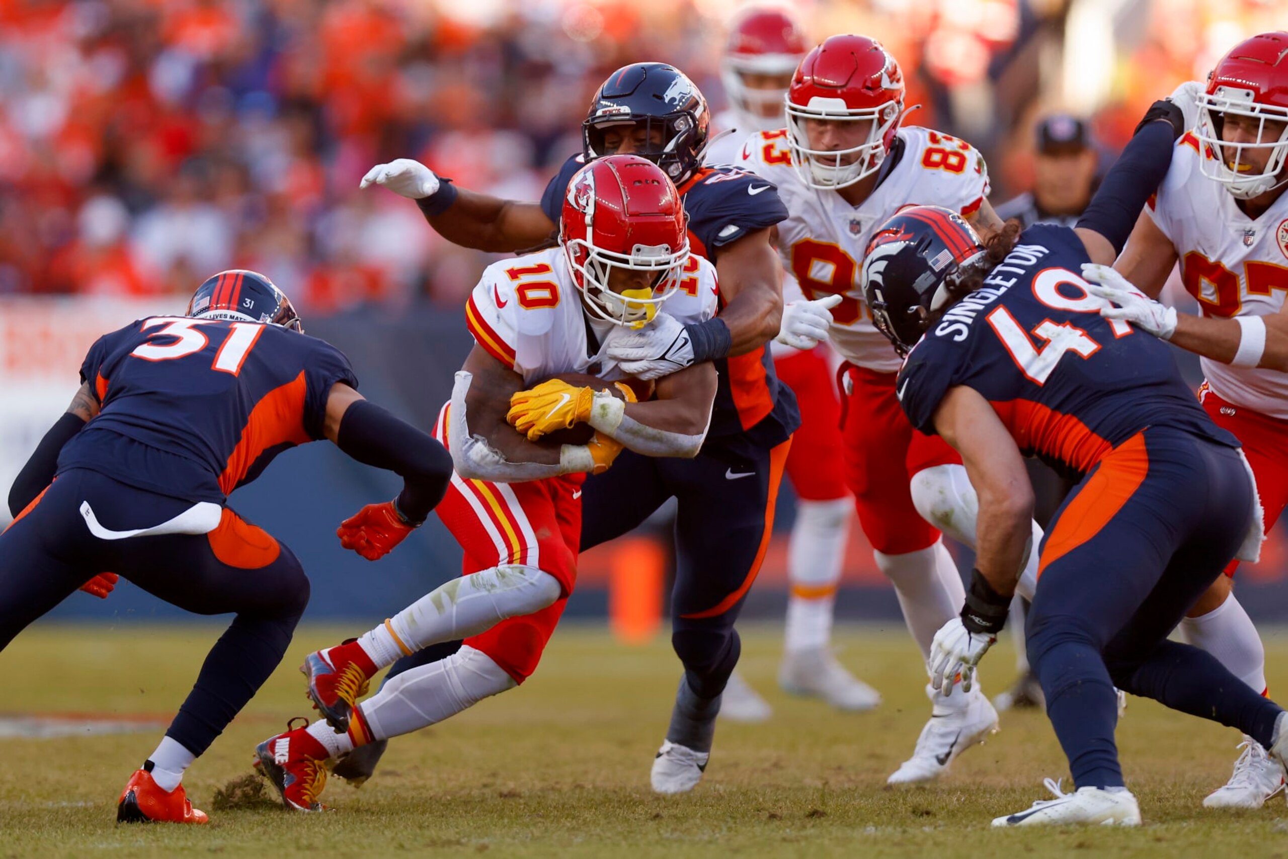 DENVER, COLORADO - DECEMBER 11: Isiah Pacheco #10 of the Kansas City Chiefs runs with the ball in the second quarter of a game against the Denver Broncos at Empower Field At Mile High on December 11, 2022 in Denver, Colorado. (Photo by Justin Edmonds/Getty Images)