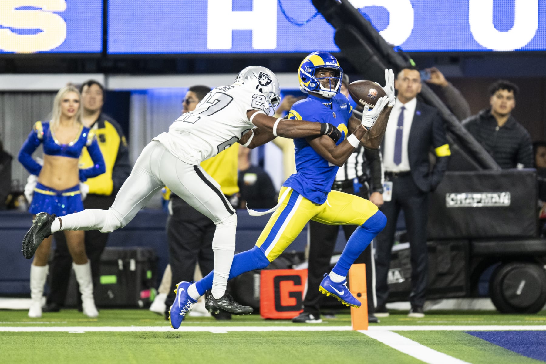 Los Angeles Rams wide receiver Van Jefferson (12) catches a pass over Las Vegas Raiders cornerback Sam Webb (27) for a touchdown during an NFL football game, Thursday, Dec. 8, 2022, in Inglewood, Calif. (AP Photo/Kyusung Gong)
