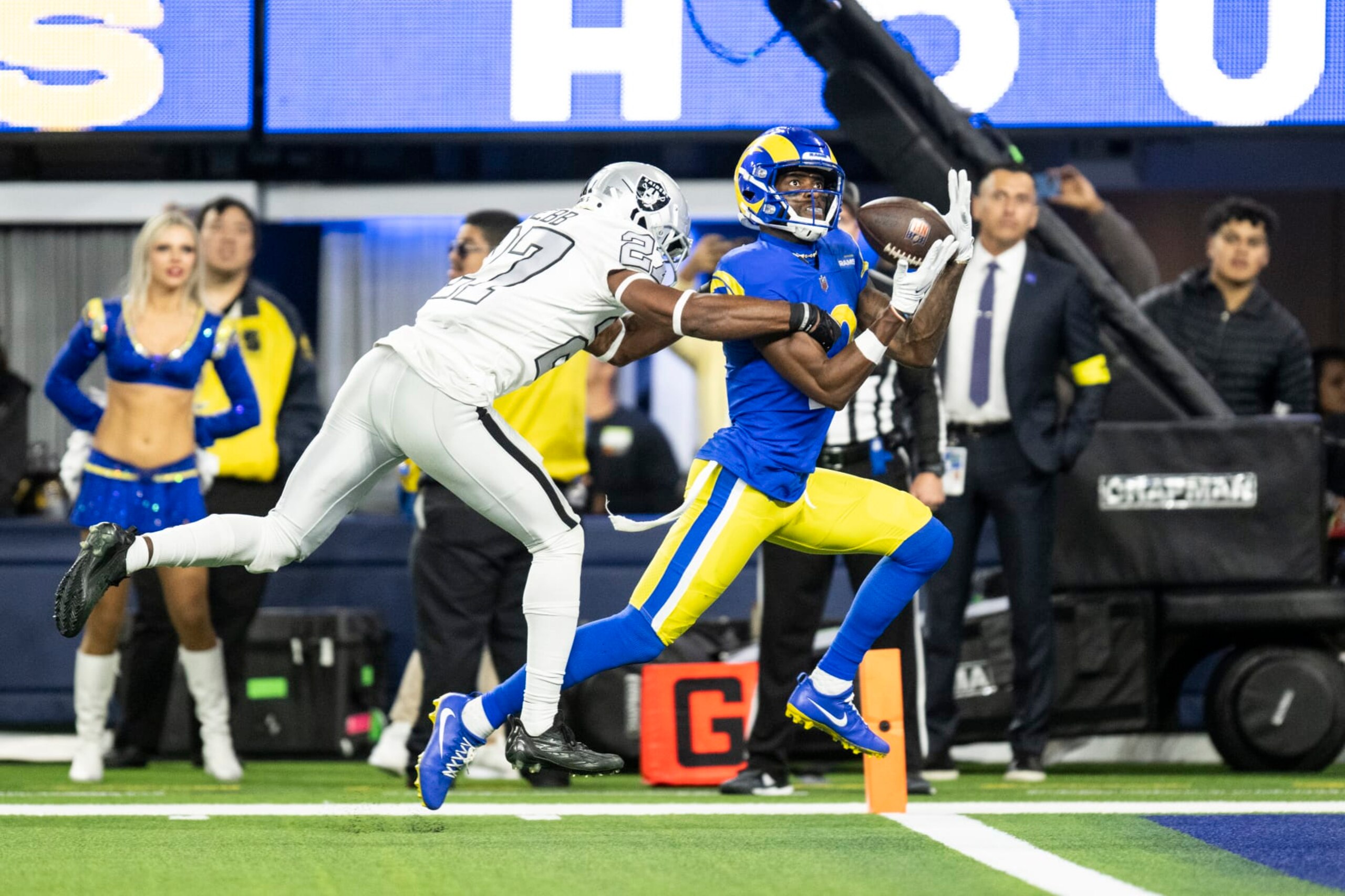 Los Angeles Rams wide receiver Van Jefferson (12) catches a pass over Las Vegas Raiders cornerback Sam Webb (27) for a touchdown during an NFL football game, Thursday, Dec. 8, 2022, in Inglewood, Calif. (AP Photo/Kyusung Gong)