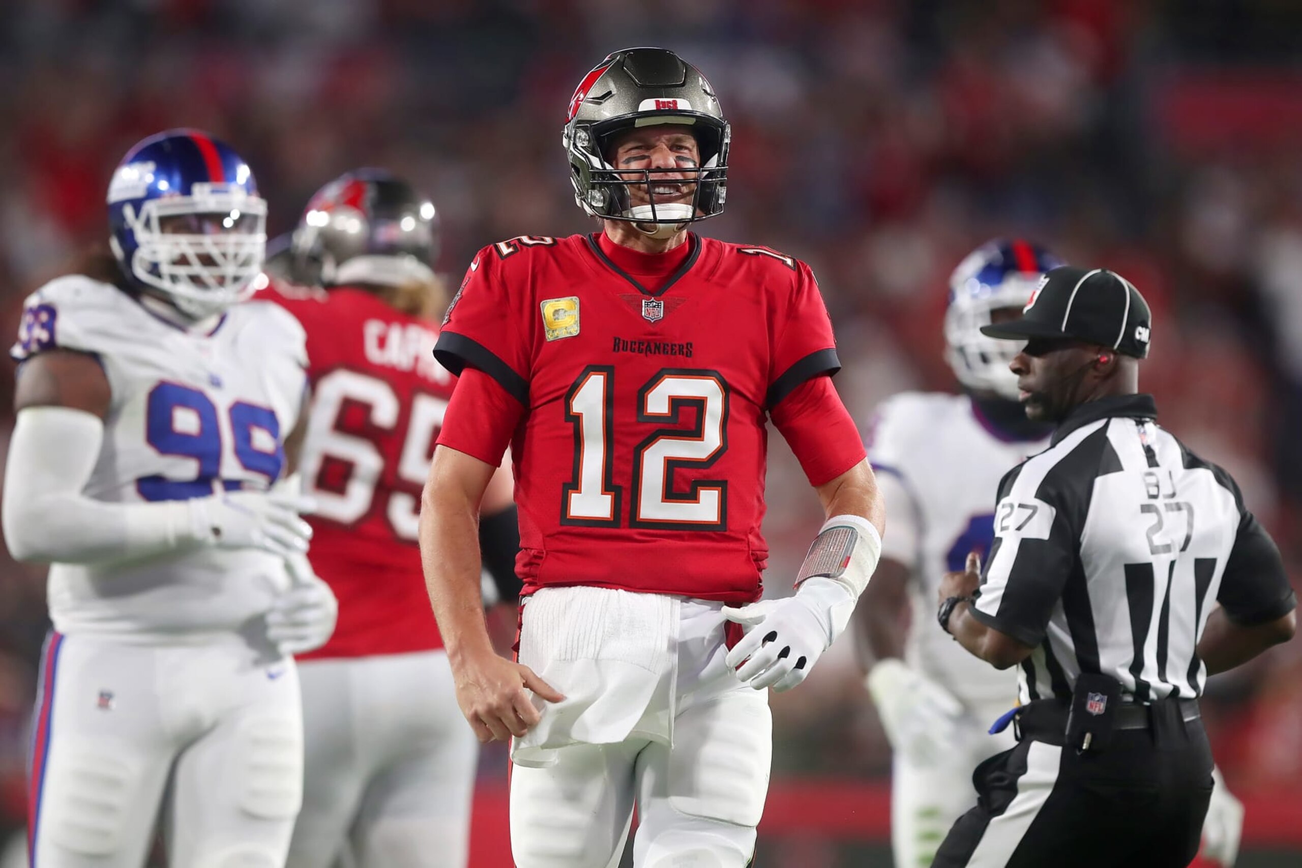 TAMPA, FL - NOVEMBER 22: Tampa Bay Buccaneers Quarterback Tom Brady (12) scrambles for a first down and hops up excited after the play during the regular season game between the New York Giants and the Tampa Bay Buccaneers on November 22, 2021 at Raymond James Stadium in Tampa, Florida. (Photo by Cliff Welch/Icon Sportswire via Getty Images)