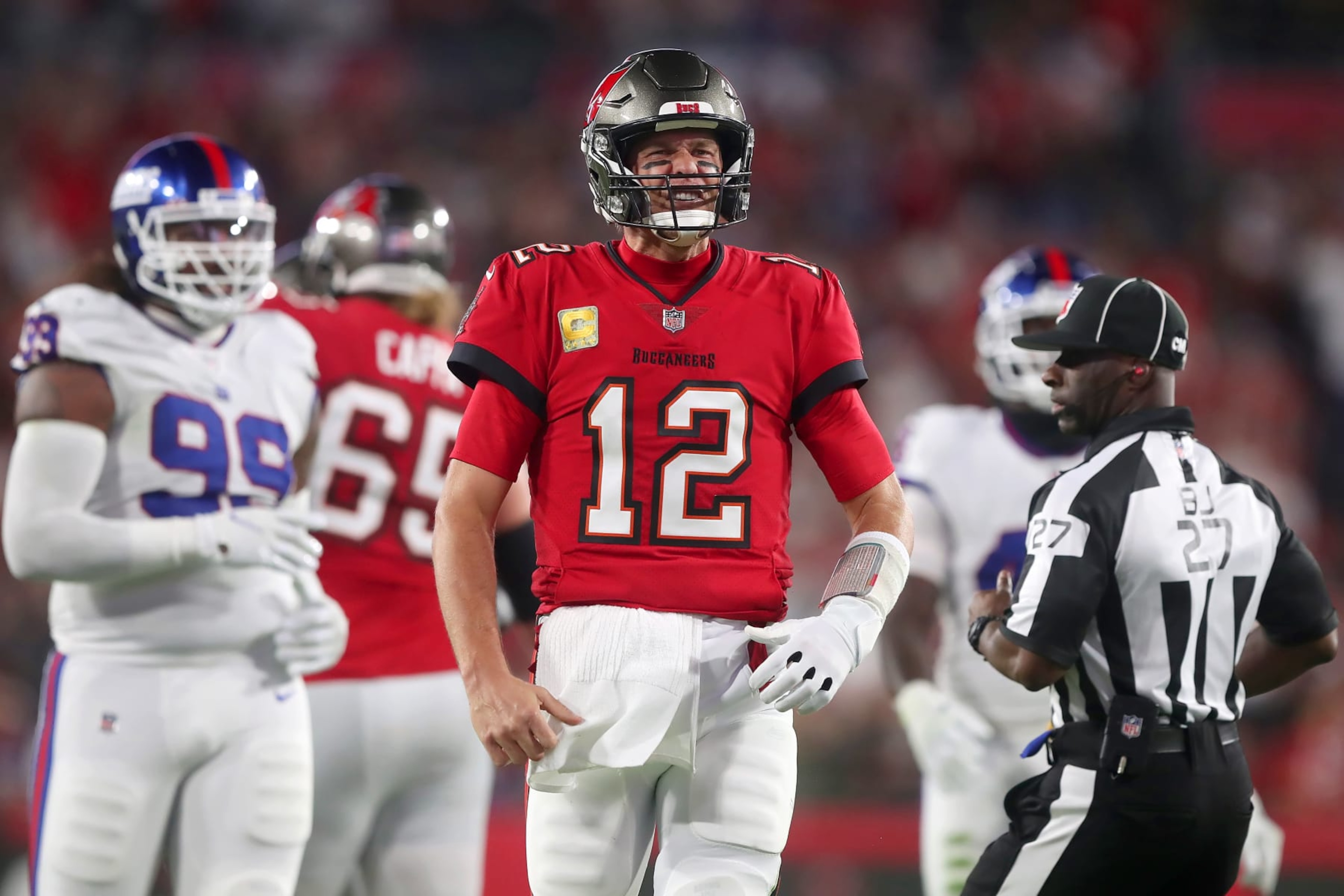 TAMPA, FL - NOVEMBER 22: Tampa Bay Buccaneers Quarterback Tom Brady (12) scrambles for a first down and hops up excited after the play during the regular season game between the New York Giants and the Tampa Bay Buccaneers on November 22, 2021 at Raymond James Stadium in Tampa, Florida. (Photo by Cliff Welch/Icon Sportswire via Getty Images)
