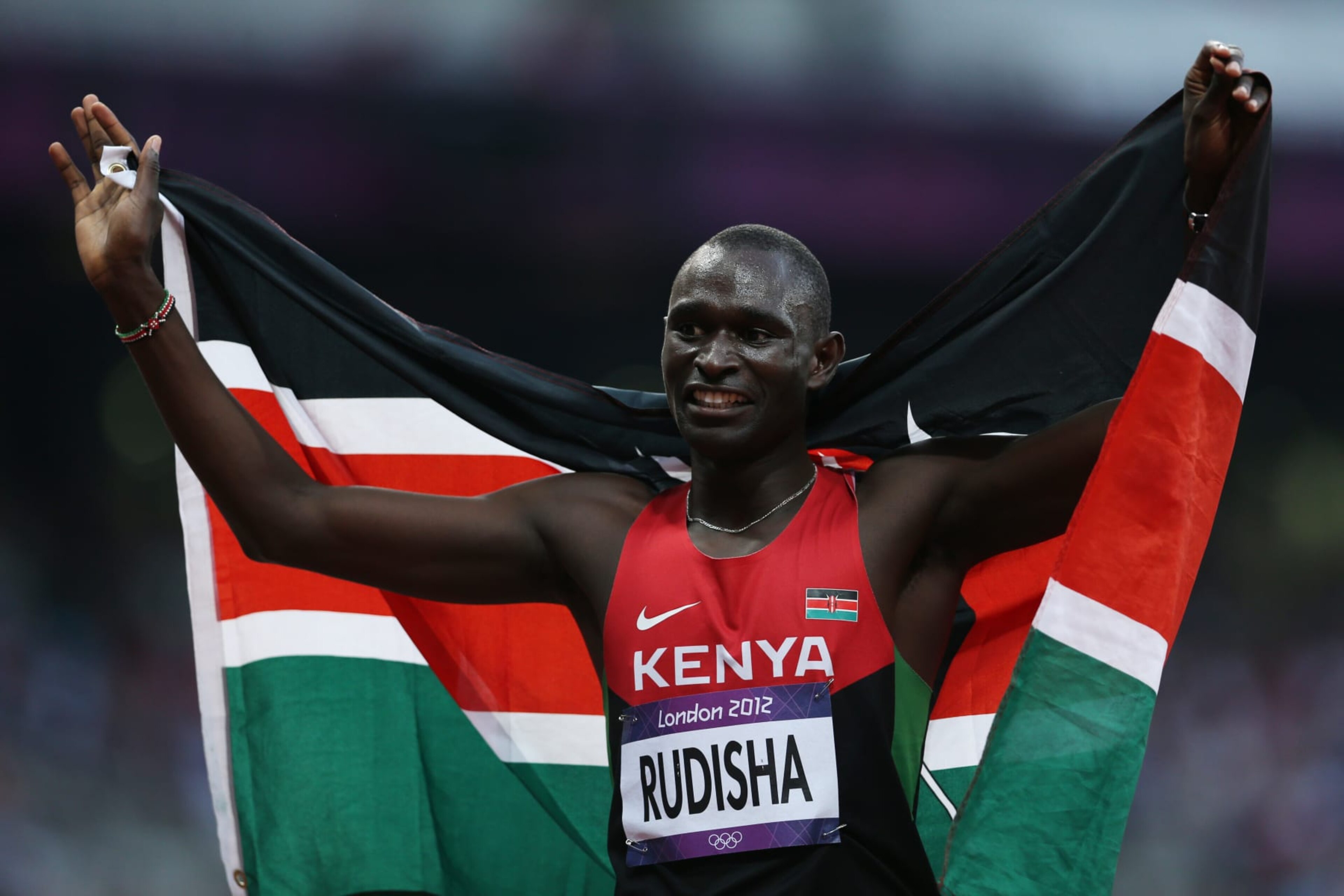 LONDON, ENGLAND - AUGUST 09: David Lekuta Rudisha of Kenya celebrates after winning gold and setting a new world record of 1:40.91 in the Men's 800m Final on Day 13 of the London 2012 Olympic Games at Olympic Stadium on August 9, 2012 in London, England. (Photo by Ian MacNicol/Getty Images) LONDON, ENGLAND - AUGUST 09: David Lekuta Rudisha of Kenya celebrates after winning gold and setting a new world record of 1:40.91 in the Men's 800m Final on Day 13 of the London 2012 Olympic Games at Olympic Stadium on August 9, 2012 in London, England. (Photo by Ian MacNicol/Getty Images)