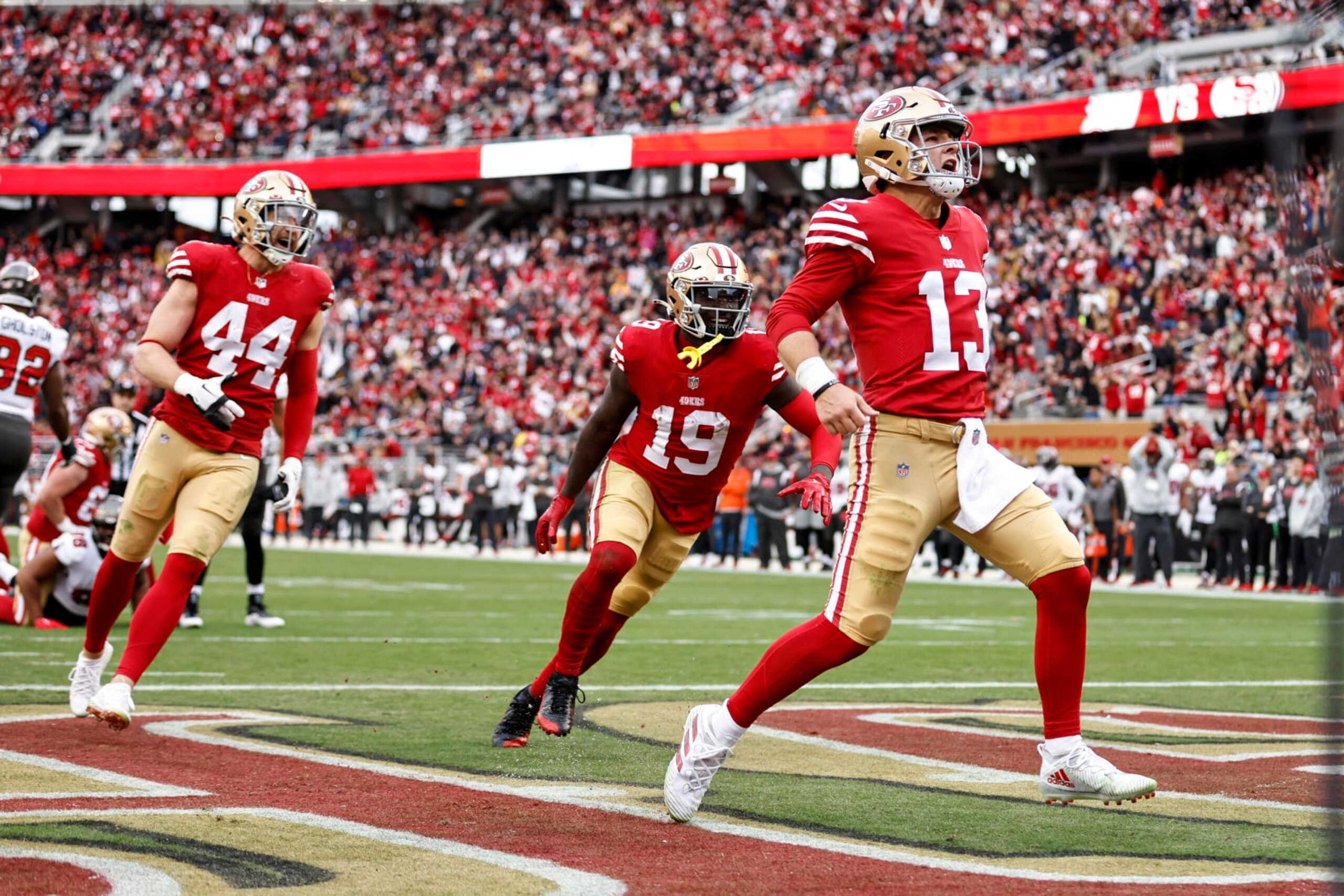 SANTA CLARA, CALIFORNIA - DECEMBER 11: Brock Purdy #13 of the San Francisco 49ers celebrates after scrambling and running for a touchdown during an NFL football game between the San Francisco 49ers and the Tampa Bay Buccaneers at Levi's Stadium on December 11, 2022 in Santa Clara, California. (Photo by Michael Owens/Getty Images)