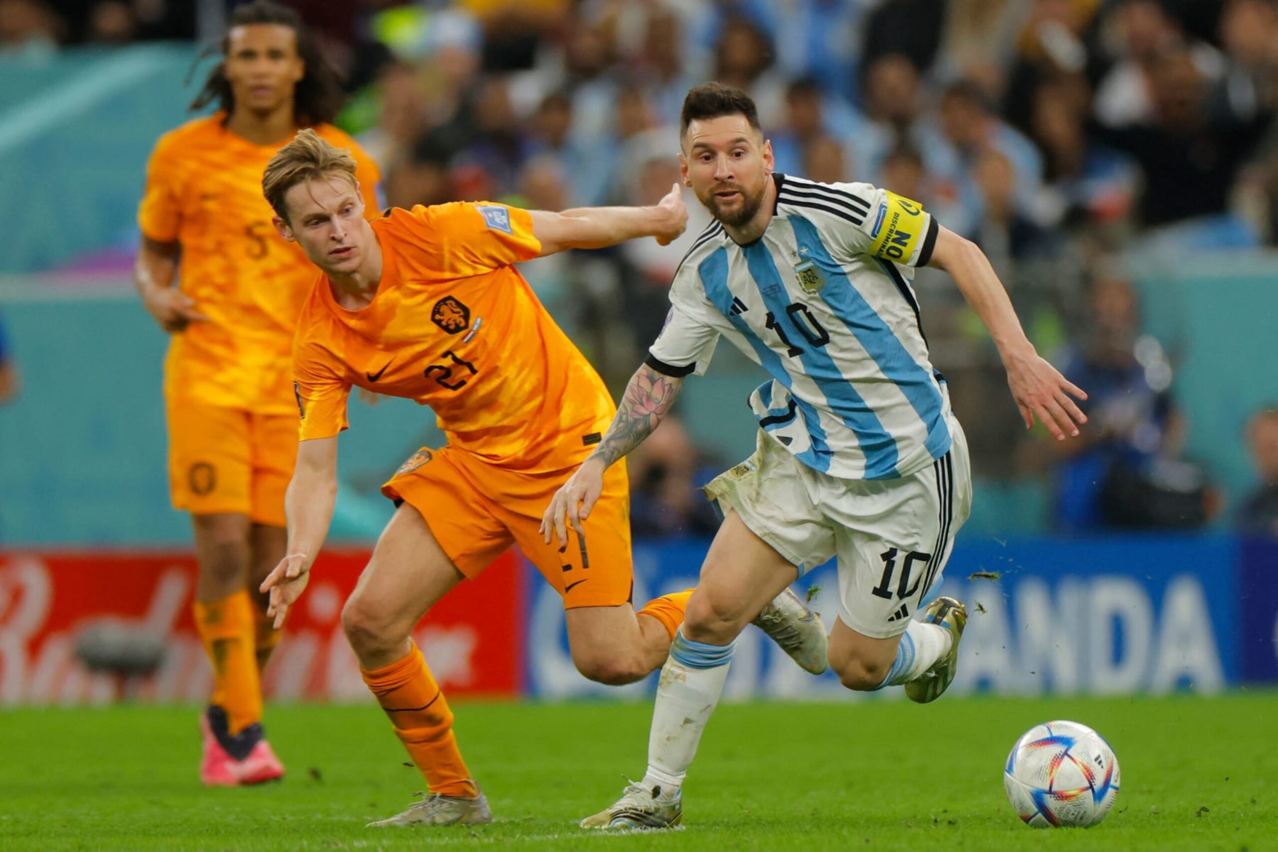 Argentina's forward #10 Lionel Messi (R) is marked by Netherlands' midfielder #21 Frenkie De Jong during the Qatar 2022 World Cup quarter-final football match between The Netherlands and Argentina at Lusail Stadium, north of Doha on December 9, 2022. (Photo by Odd ANDERSEN / AFP) (Photo by ODD ANDERSEN/AFP via Getty Images)