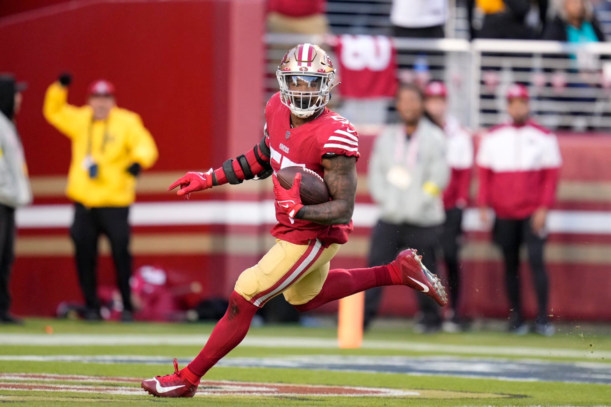 San Francisco 49ers linebacker Dre Greenlaw returns a fumble recovery for a touchdown during the second half of an NFL football game against the Miami Dolphins in Santa Clara, Calif., Sunday, Dec. 4, 2022. (AP Photo/Godofredo A. Vásquez)
