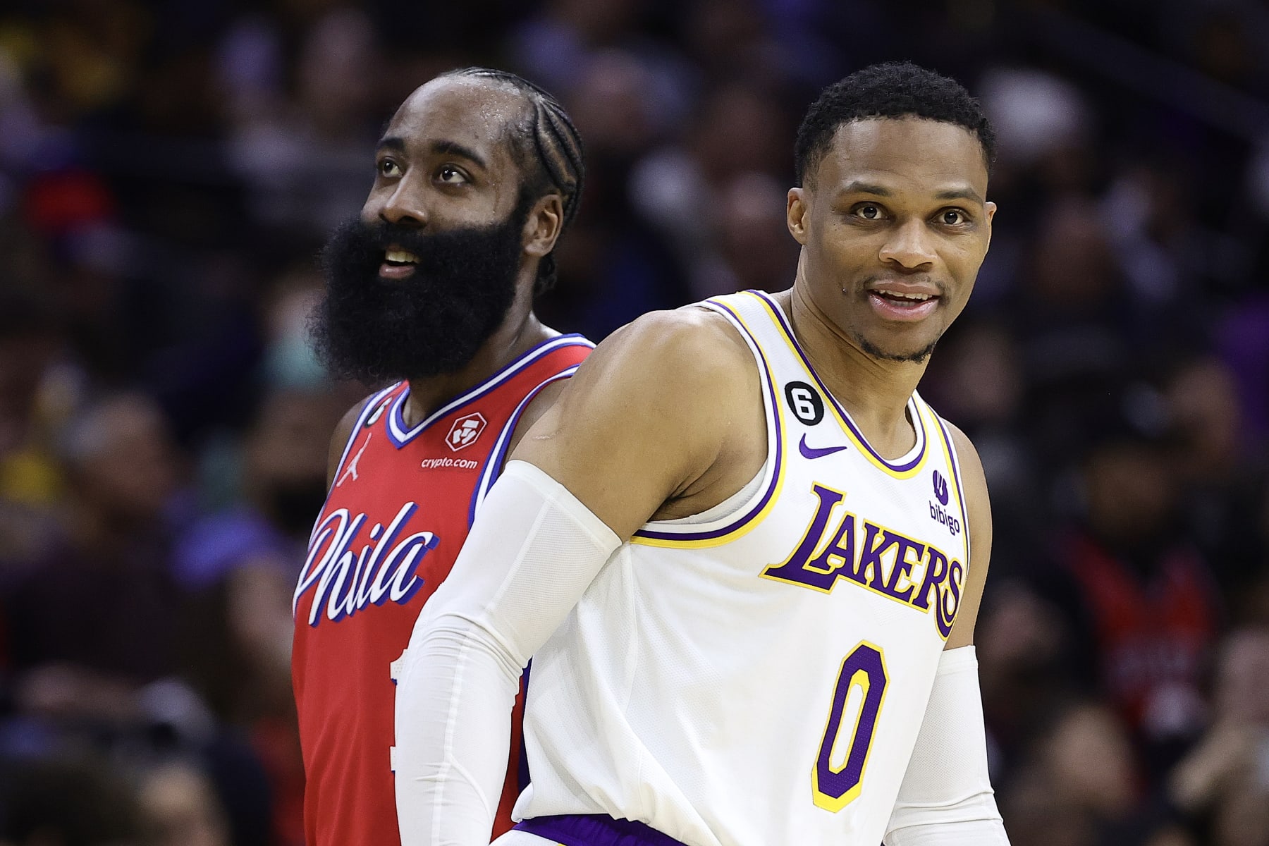 PHILADELPHIA, PENNSYLVANIA - DECEMBER 09: James Harden #1 of the Philadelphia 76ers and Russell Westbrook #0 of the Los Angeles Lakers look on during the third quarter at Wells Fargo Center on December 09, 2022 in Philadelphia, Pennsylvania. NOTE TO USER: User expressly acknowledges and agrees that, by downloading and or using this photograph, User is consenting to the terms and conditions of the Getty Images License Agreement. (Photo by Tim Nwachukwu/Getty Images)