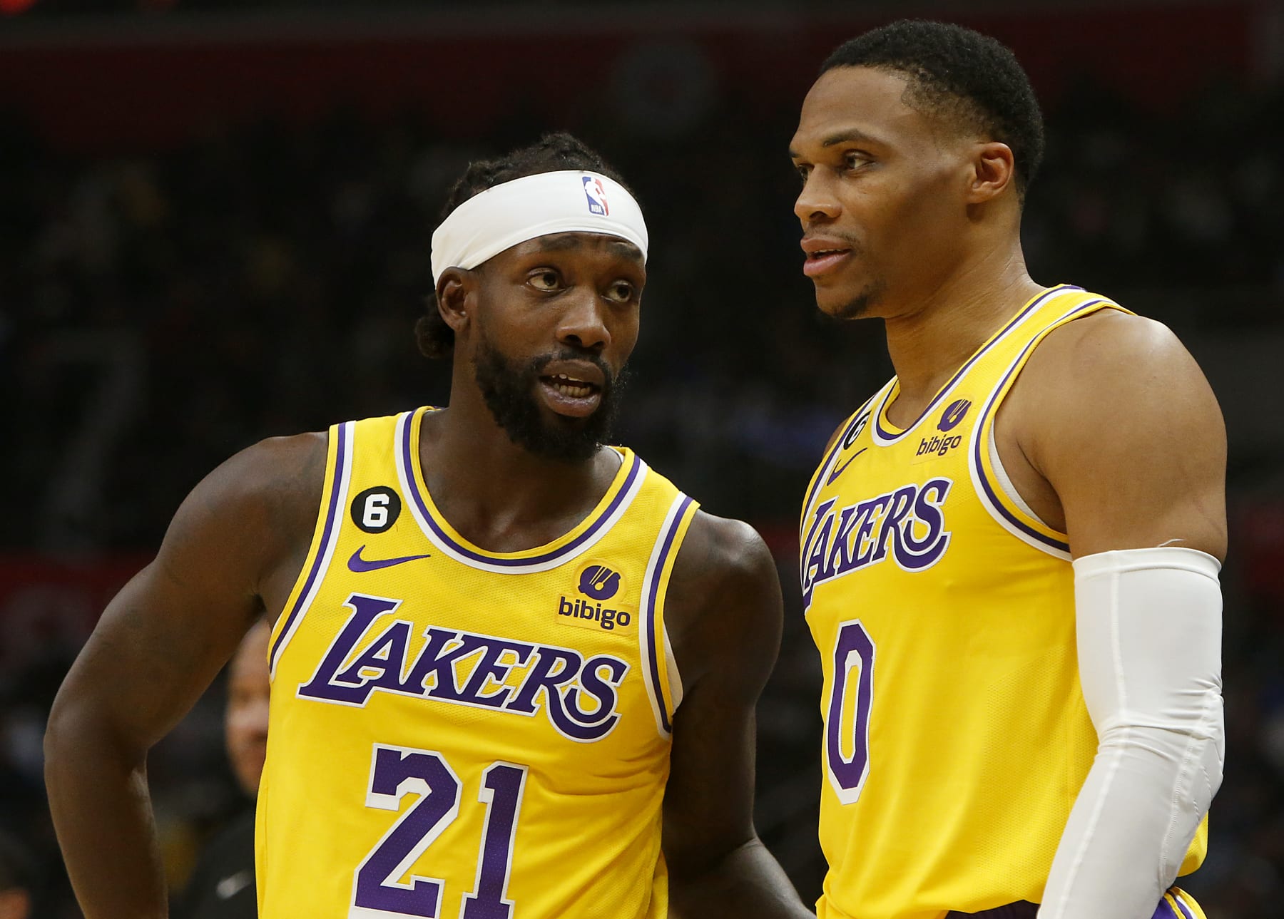 LOS ANGELES, CALIF. - NOV. 9, 2022. Laker guards Patrick Beverley, left, and Russell Westbrook talk during a break in the action of the game against the Clippers at Crypto.com Arena in Los Angeles on Wednesday night, Nov. 9, 2022. (Luis Sinco / Los Angeles Times via Getty Images)
