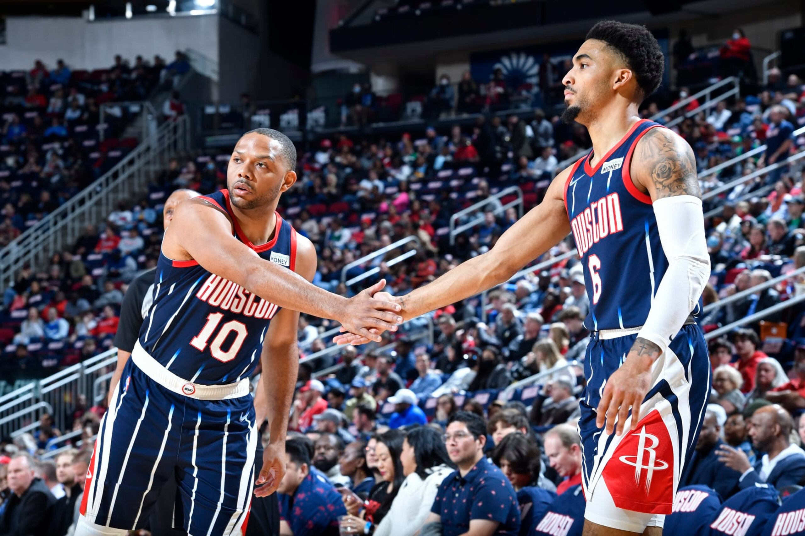 HOUSTON, TX - MARCH 11: Eric Gordon #10 of the Houston Rockets high fives Kenyon Martin Jr. #6 of the Houston Rockets during the game against the Dallas Mavericks on March 11, 2022 at the Toyota Center in Houston, Texas. NOTE TO USER: User expressly acknowledges and agrees that, by downloading and or using this photograph, User is consenting to the terms and conditions of the Getty Images License Agreement. Mandatory Copyright Notice: Copyright 2022 NBAE (Photo by Logan Riely/NBAE via Getty Images)