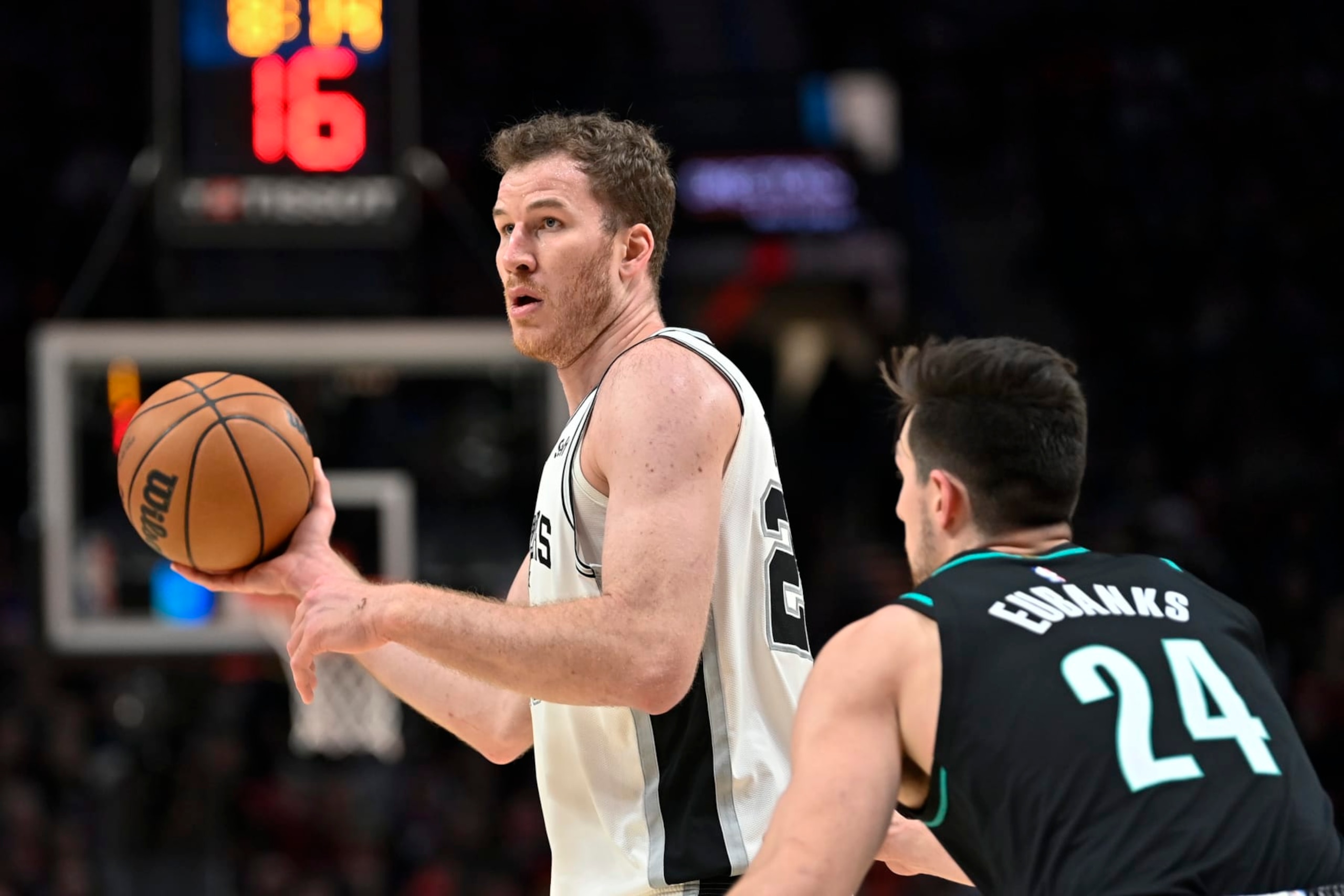 PORTLAND, OREGON - NOVEMBER 15: Jakob Poeltl #25 of the San Antonio Spurs and Drew Eubanks #24 of the Portland Trail Blazers in action during the fourth quarter at the Moda Center on November 15, 2022 in Portland, Oregon. The Portland Trail Blazers won 117-110. NOTE TO USER: User expressly acknowledges and agrees that, by downloading and or using this photograph, User is consenting to the terms and conditions of the Getty Images License Agreement. (Photo by Alika Jenner/Getty Images)