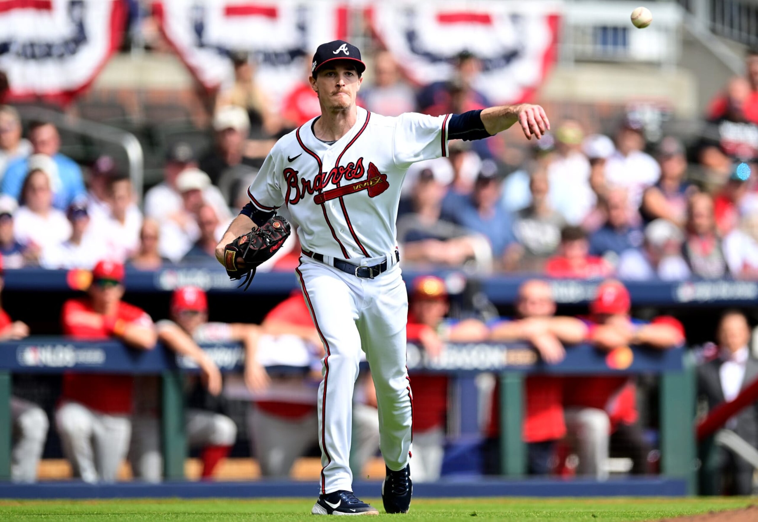 ATLANTA, GEORGIA - OCTOBER 11: Max Fried #54 of the Atlanta Braves throws to first base against the Philadelphia Phillies during the third inning in game one of the National League Division Series at Truist Park on October 11, 2022 in Atlanta, Georgia. (Photo by Adam Hagy/Getty Images)