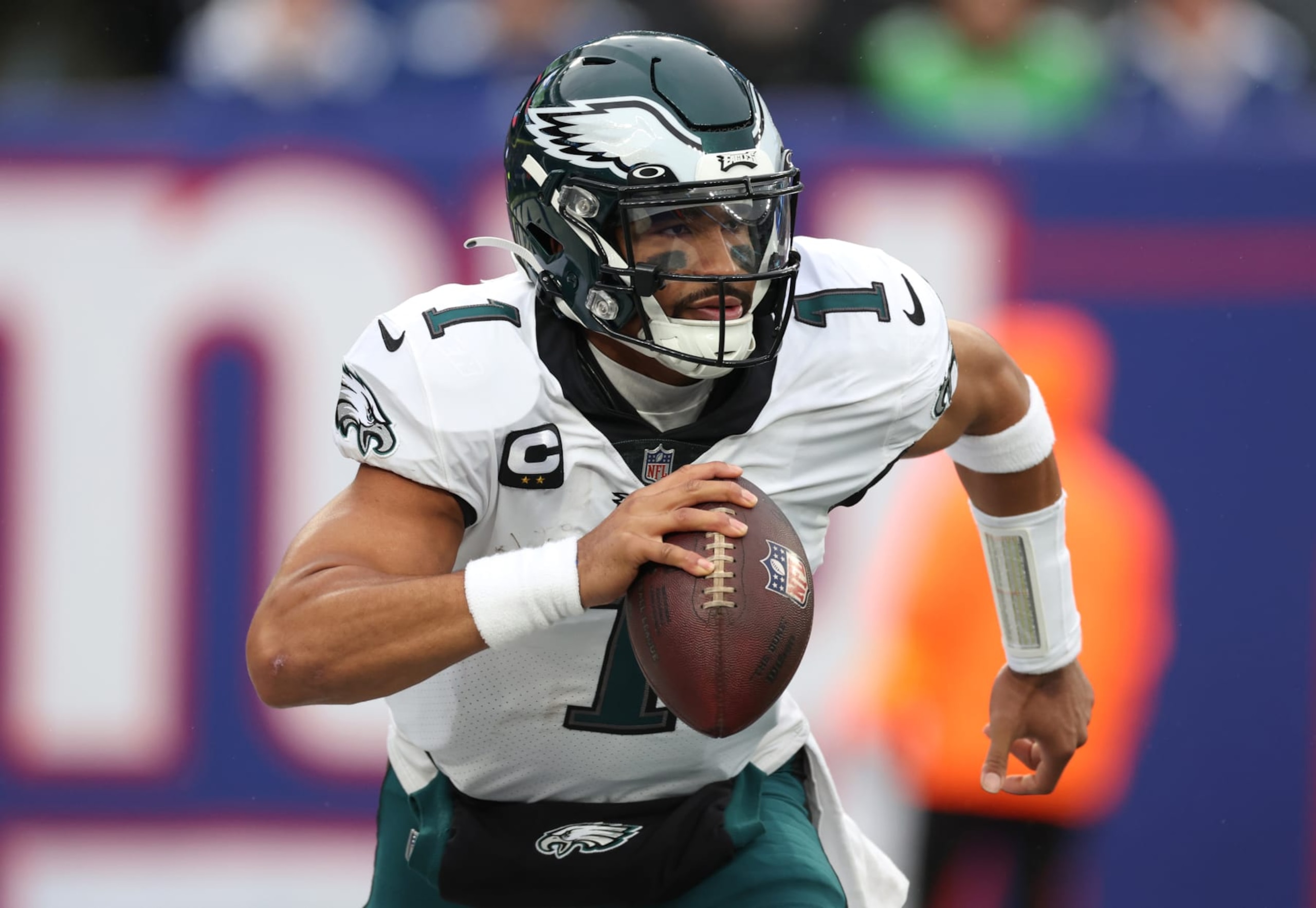 EAST RUTHERFORD, NEW JERSEY - DECEMBER 11: Jalen Hurts #1 of the Philadelphia Eagles carries the ball during the first half of the game against the New York Giants at MetLife Stadium on December 11, 2022 in East Rutherford, New Jersey. (Photo by Al Bello/Getty Images)