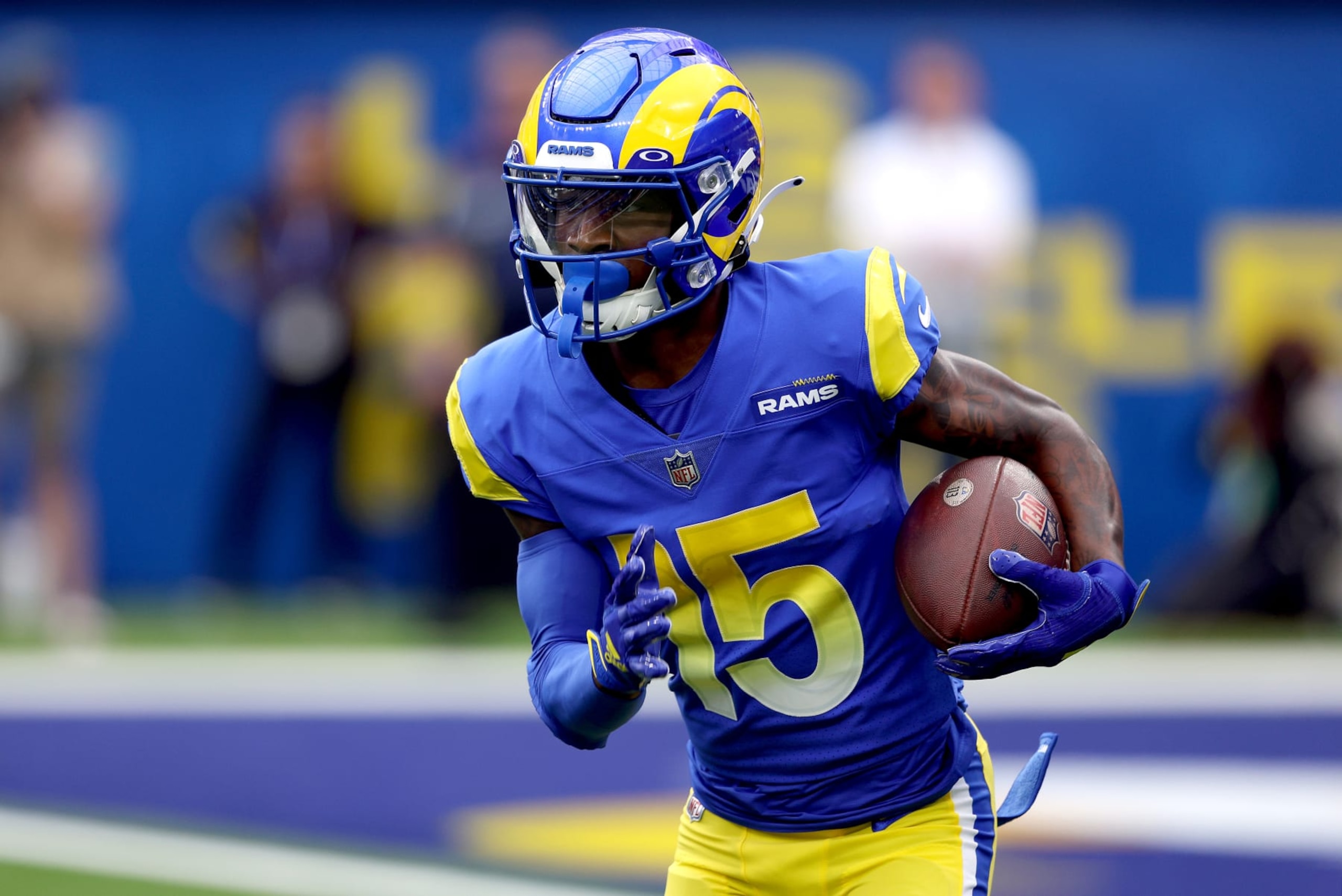 INGLEWOOD, CALIFORNIA - OCTOBER 16: Tutu Atwell #15 of the Los Angeles Rams takes a handoff in the first quarter of a game against the Carolina Panthers at SoFi Stadium on October 16, 2022 in Inglewood, California. (Photo by Harry How/Getty Images)