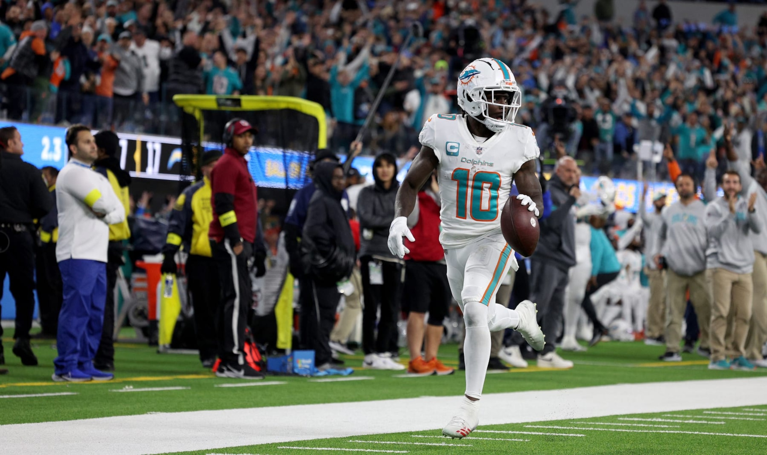 INGLEWOOD, CALIFORNIA - DECEMBER 11: Tyreek Hill #10 of the Miami Dolphins celebrates a touchdown in the third quarter during a game against the Los Angeles Chargers at SoFi Stadium on December 11, 2022 in Inglewood, California. (Photo by Harry How/Getty Images)