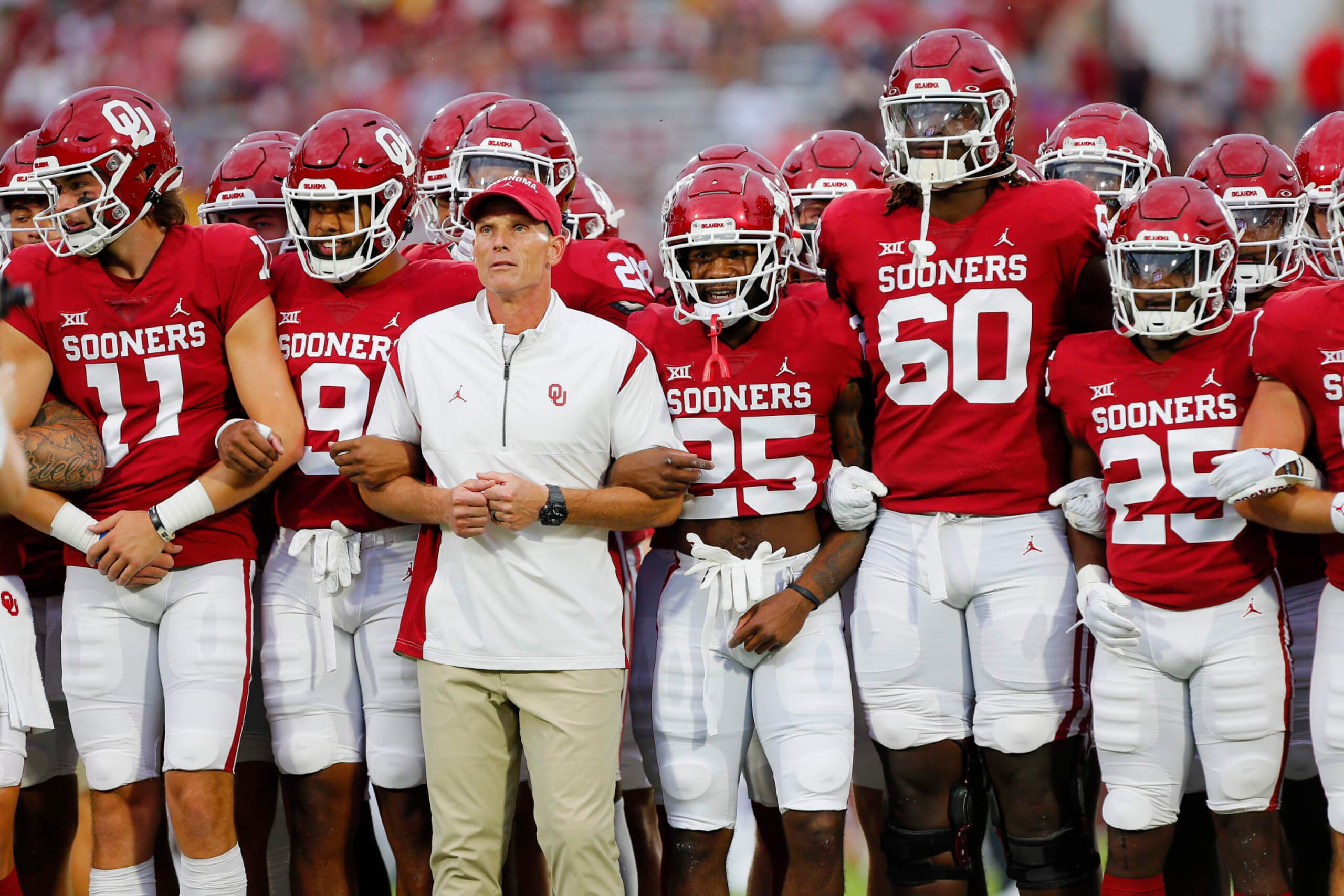 NORMAN, OK - SEPTEMBER 24:  Head coach Brent Venables and the Oklahoma Sooners march to the end zone arm in arm before a game against the Kansas State Wildcats at Gaylord Family Oklahoma Memorial Stadium on September 24, 2022 in Norman, Oklahoma.  Kansas State won 41-34.  (Photo by Brian Bahr/Getty Images)