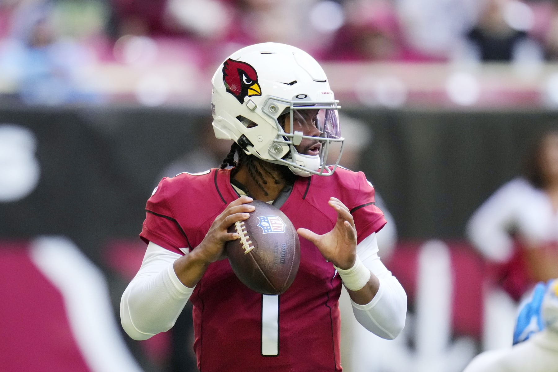Arizona Cardinals quarterback Kyler Murray looks to pass the ball against the Los Angeles Chargers during the first half of an NFL football game in Glendale, Ariz., Sunday, Nov. 27, 2022. The Chargers won 25-24. (AP Photo/Ross D. Franklin)